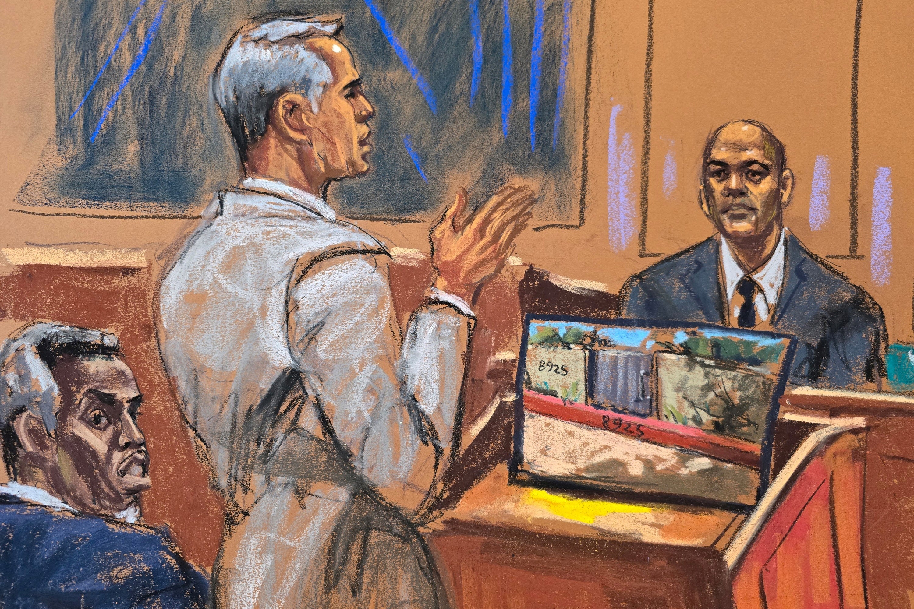 Combs watches as his defense lawyer Brian Steel cross-examines Los Angeles Police Department Officer Christopher Ignacio