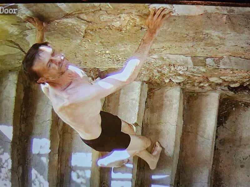 Authorities released a photo of Michael Paul Brown, barefoot and shirtless, walking down what appeared to be a flight of outdoor concrete steps. Brown is suspected of shooting and killing four people in local Montana bar