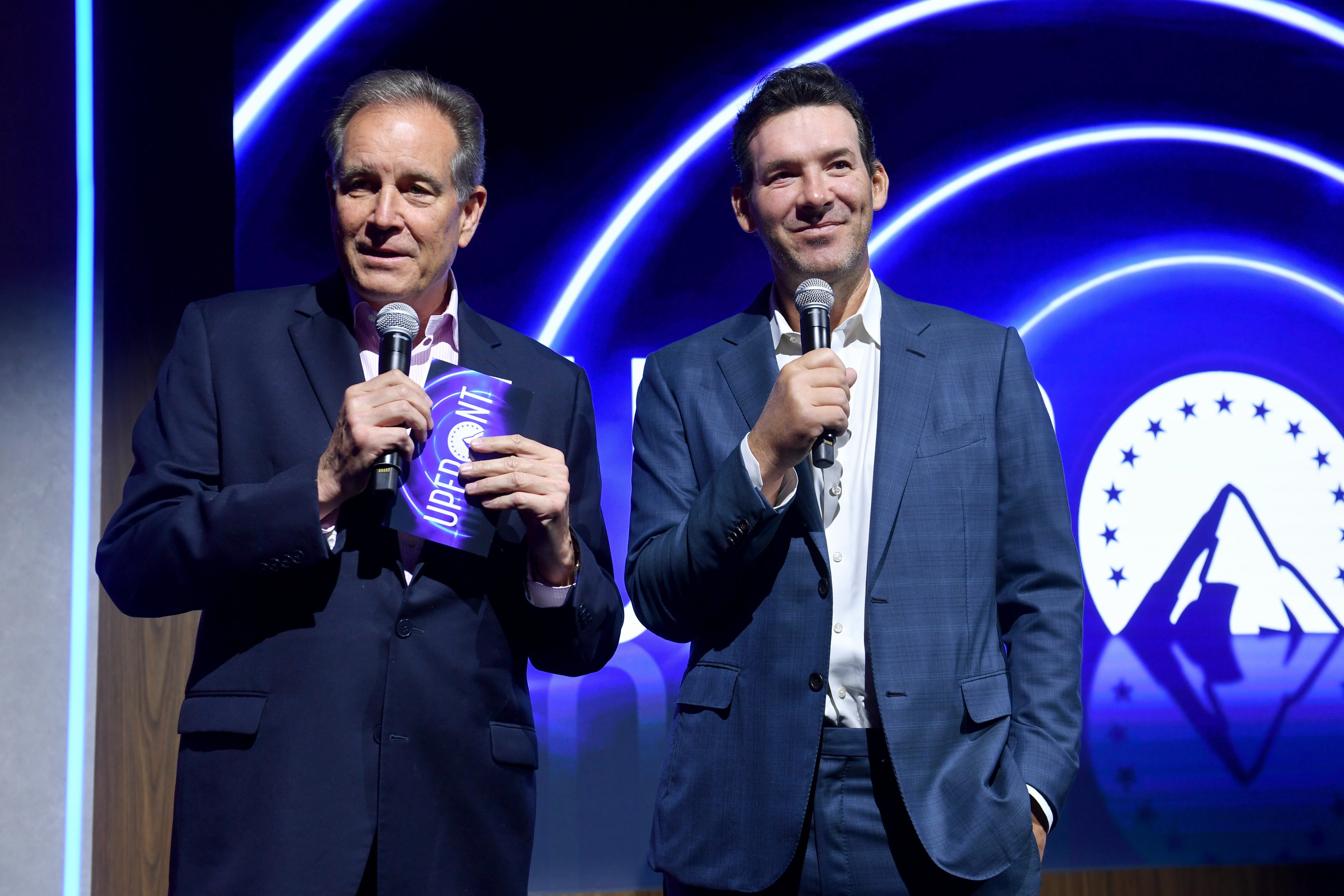 CBS Sports placed Romo (right) on leave from his primary position as the network's lead game analyst after his arrest