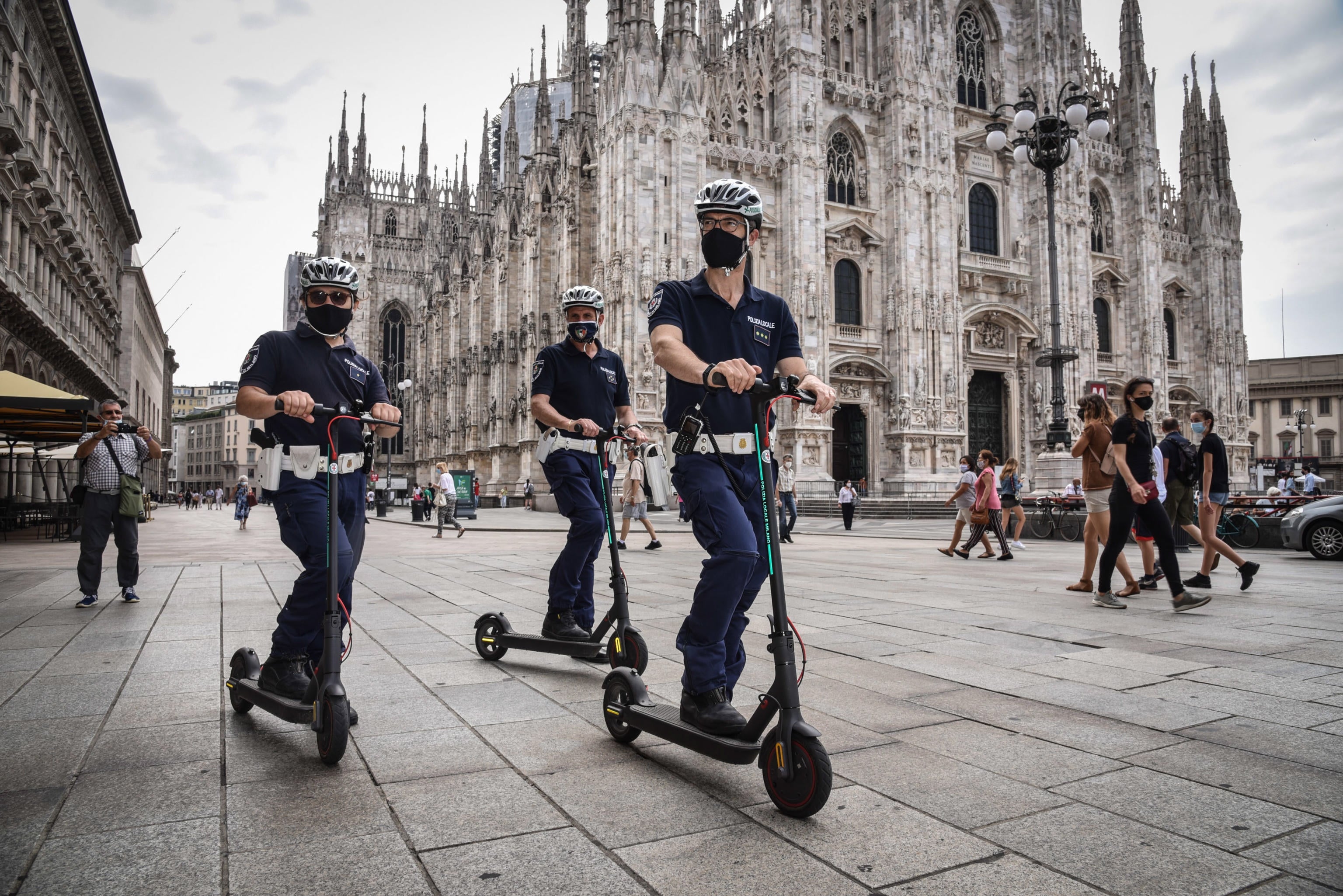 Local police patrol on scooters in Milan