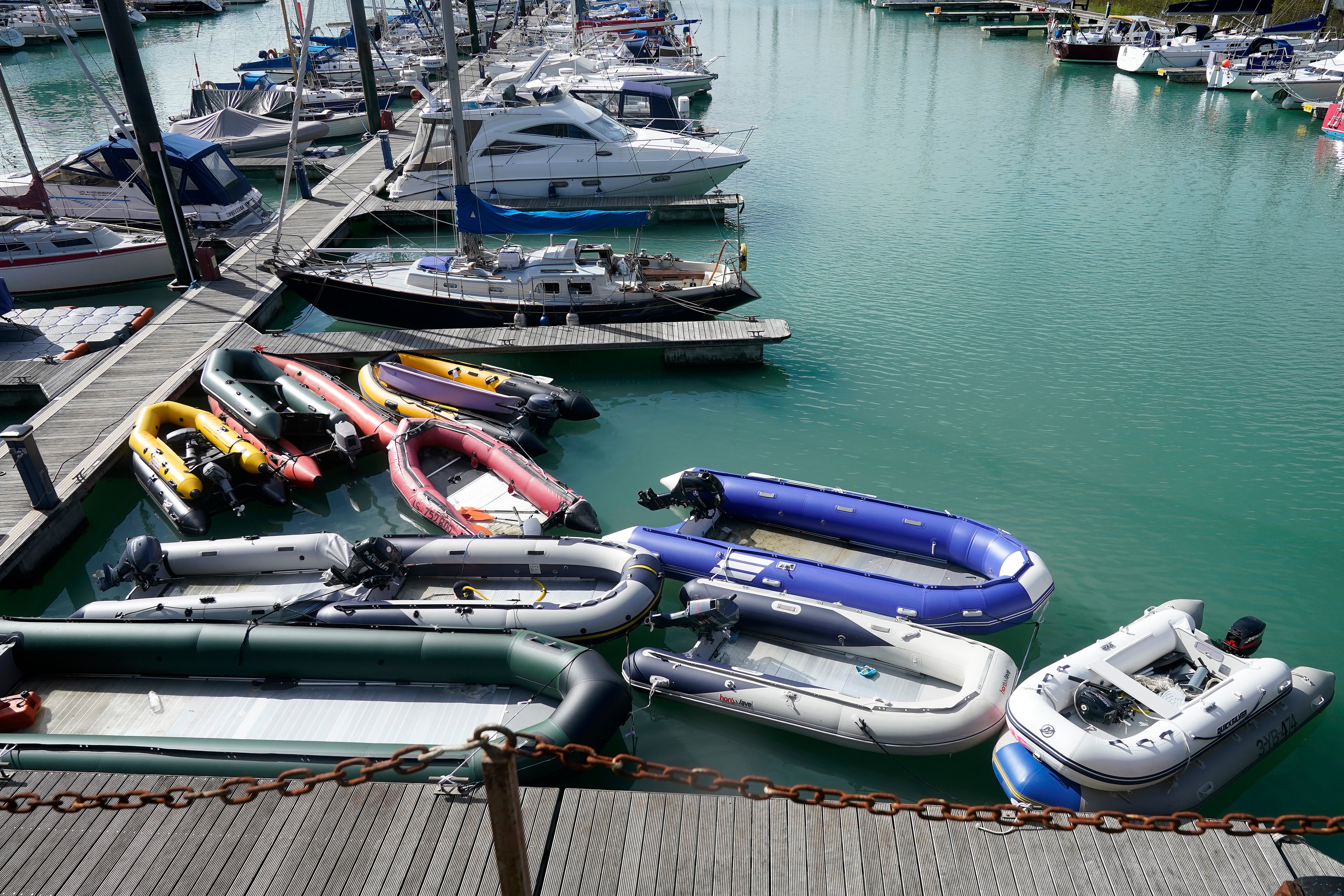 Inflatable dinghies, believed to have been used by migrants to cross the Channel, are stored at Dover Marina