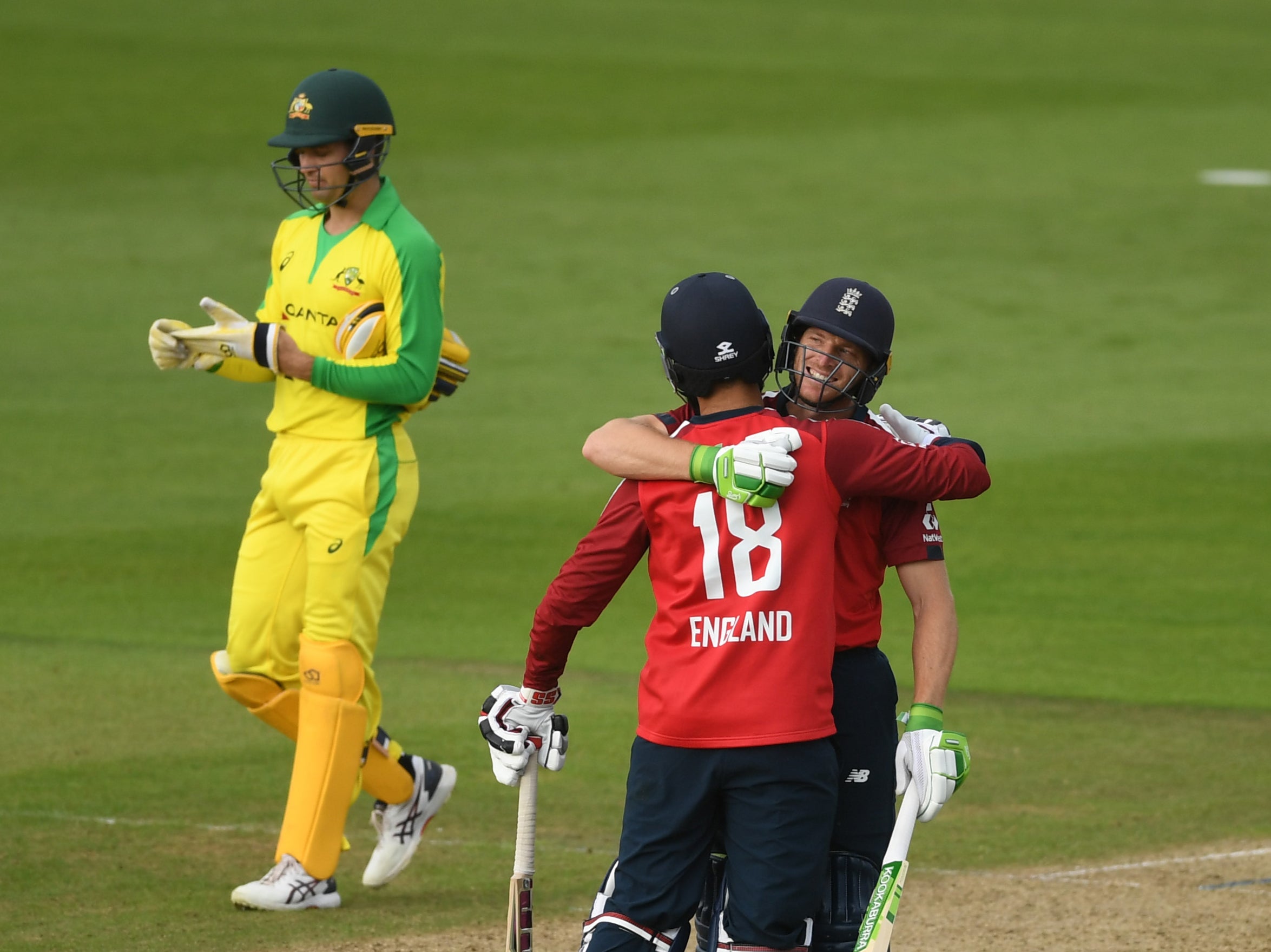 Jos Buttler (right) celebrates with team-mate Moeen Ali