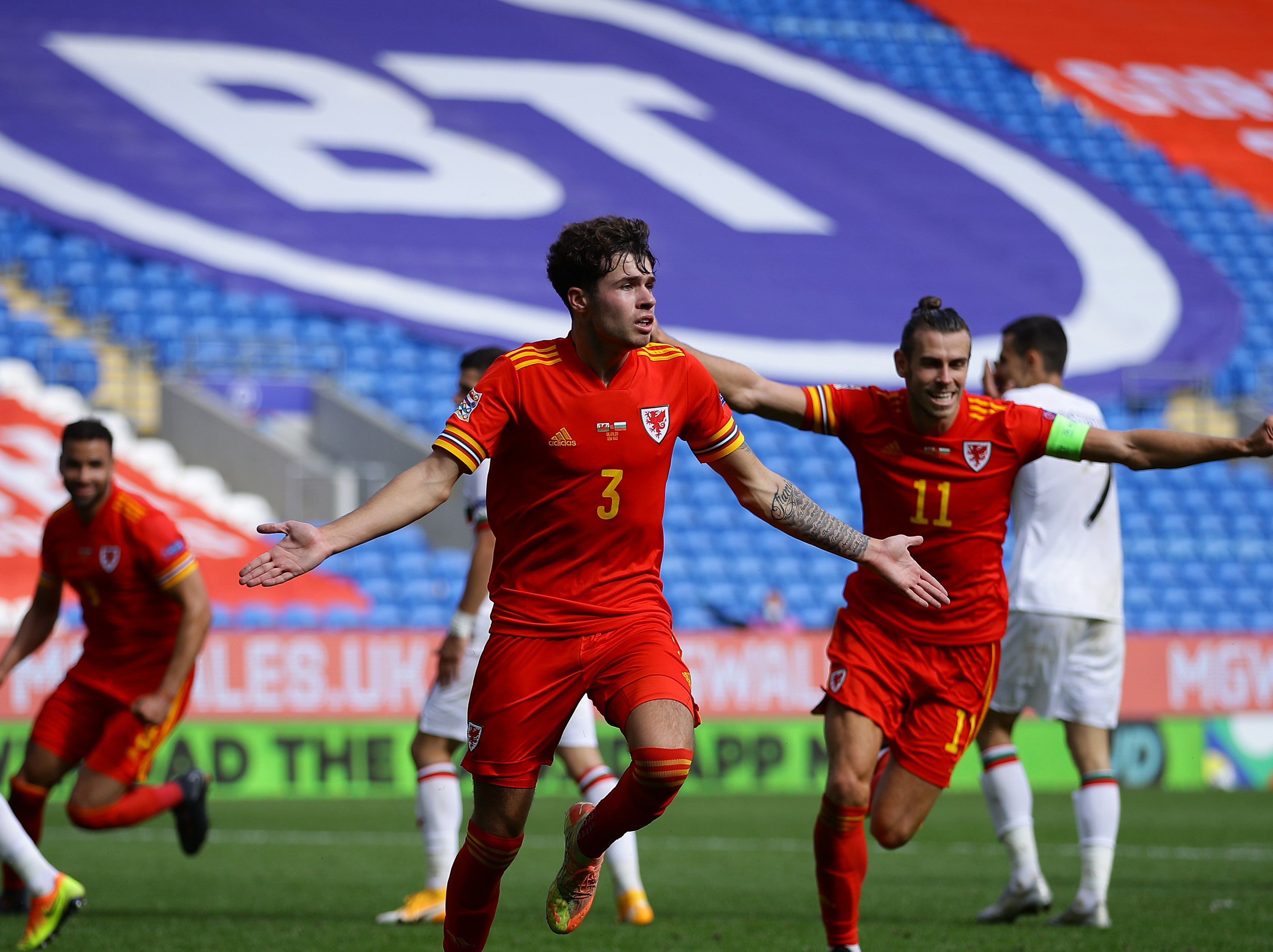 Neco Williams celebrates securing a late win for Wales