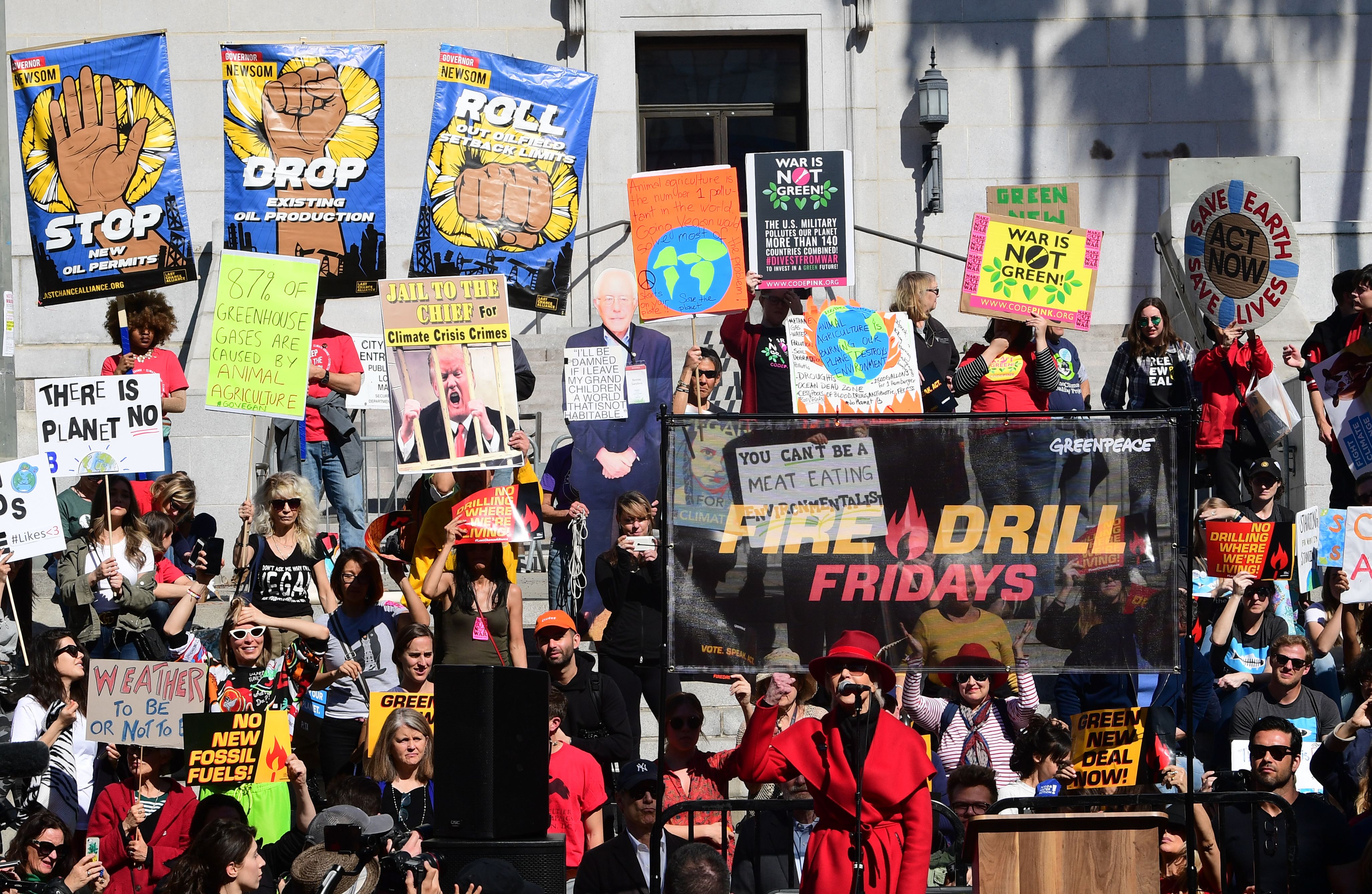 Fonda in the famous red coat speaks during the Fire Drill Friday fossil fuel protest in California