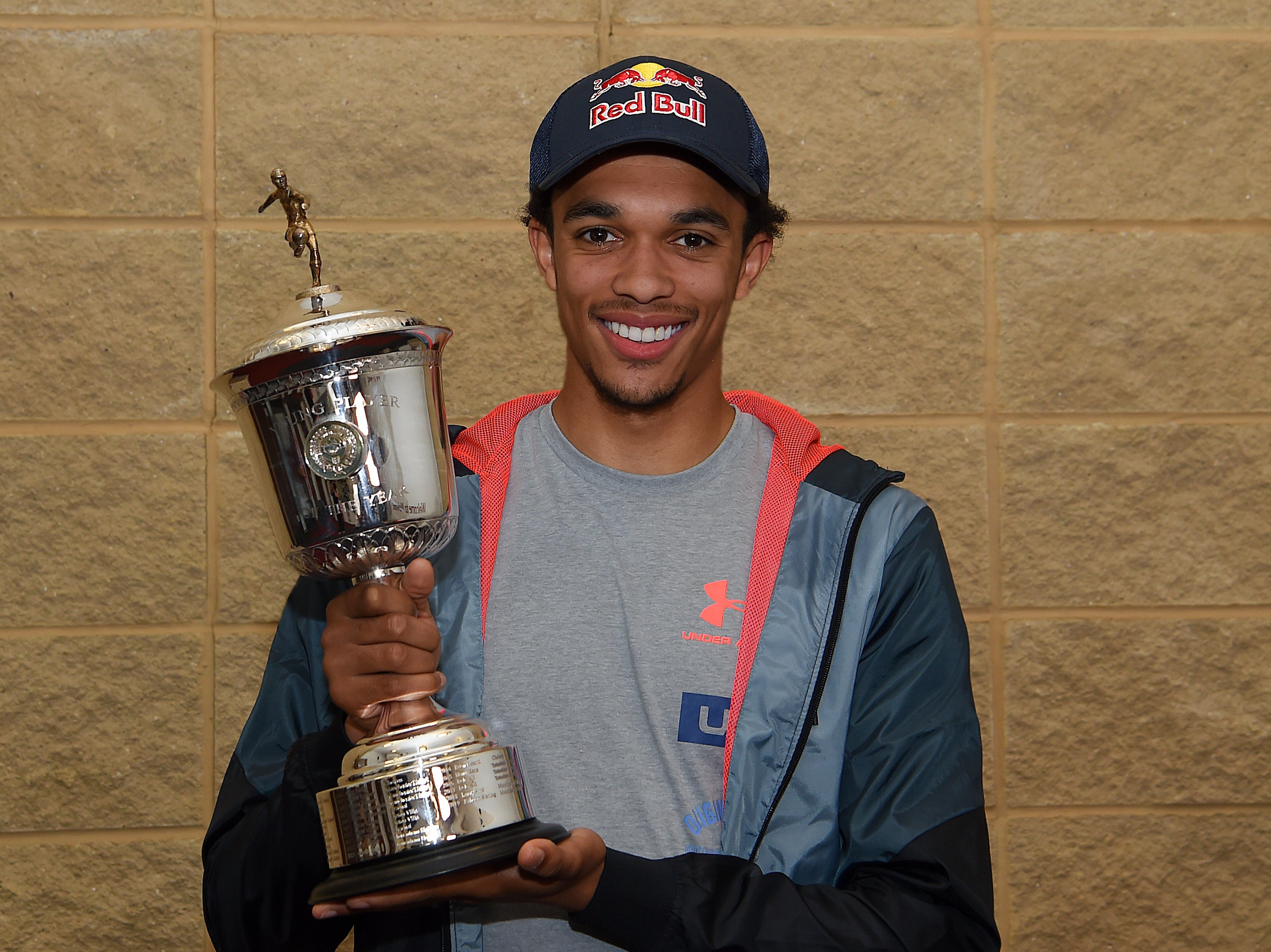 Trent Alexander-Arnold poses with the trophy