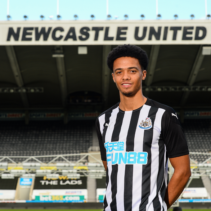 Newcastle United's new signing Jamal Lewis poses in his new kit