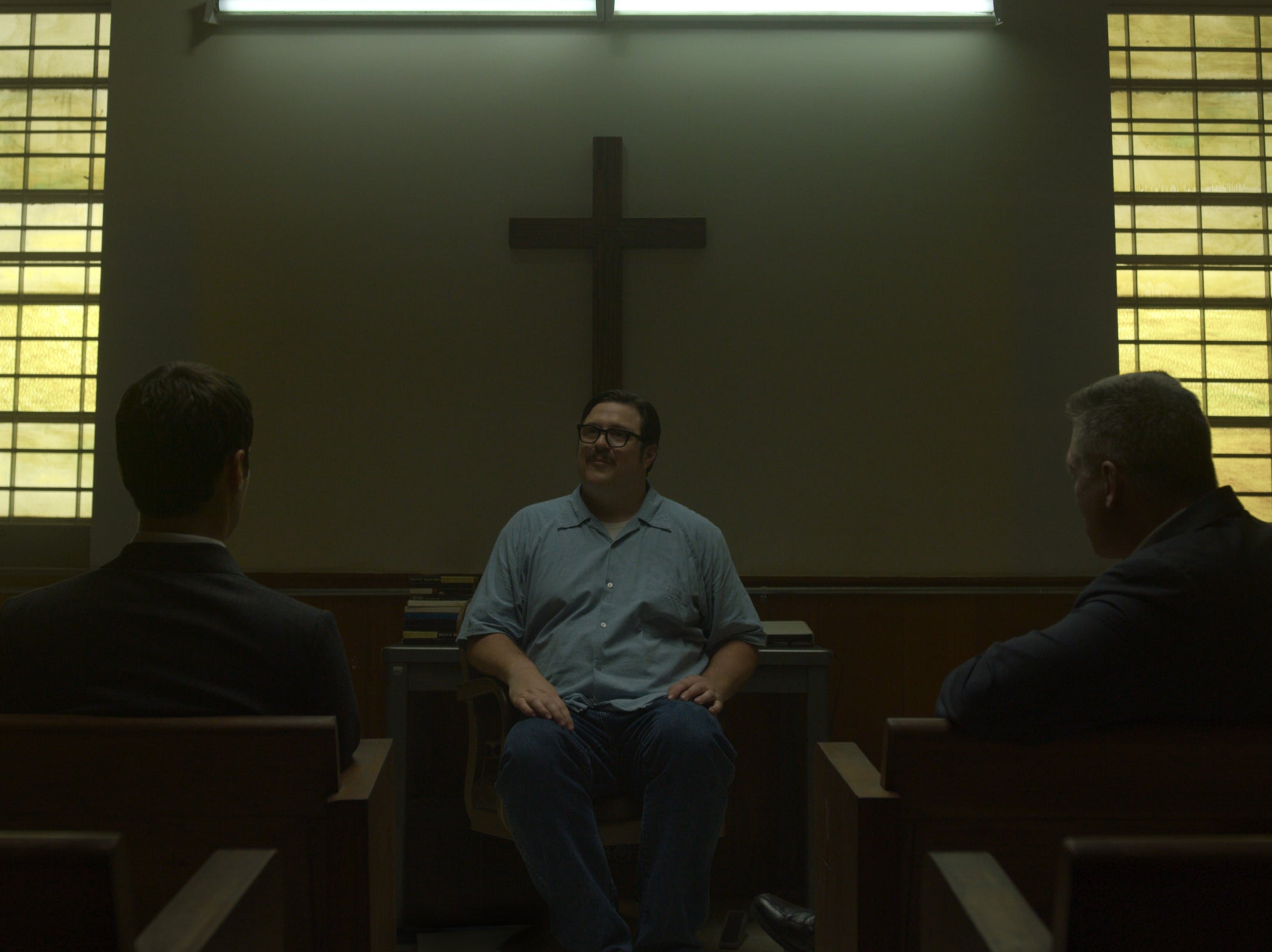 Chilling: Cameron Britton (centre) as Ed Kemper in the Netflix series 'Mindhunter'