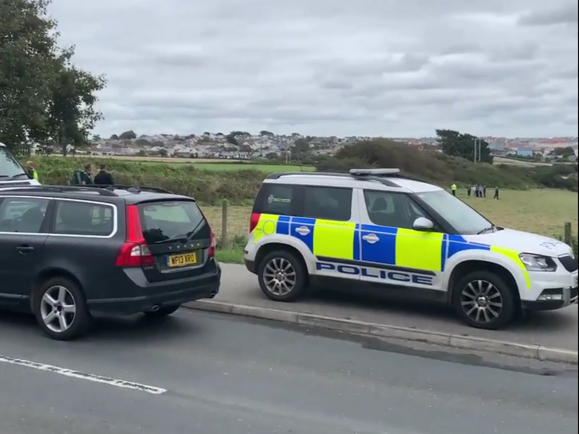 The police officer was attacked while helping bailiffs with an eviction from private land in Newquay, Cornwall