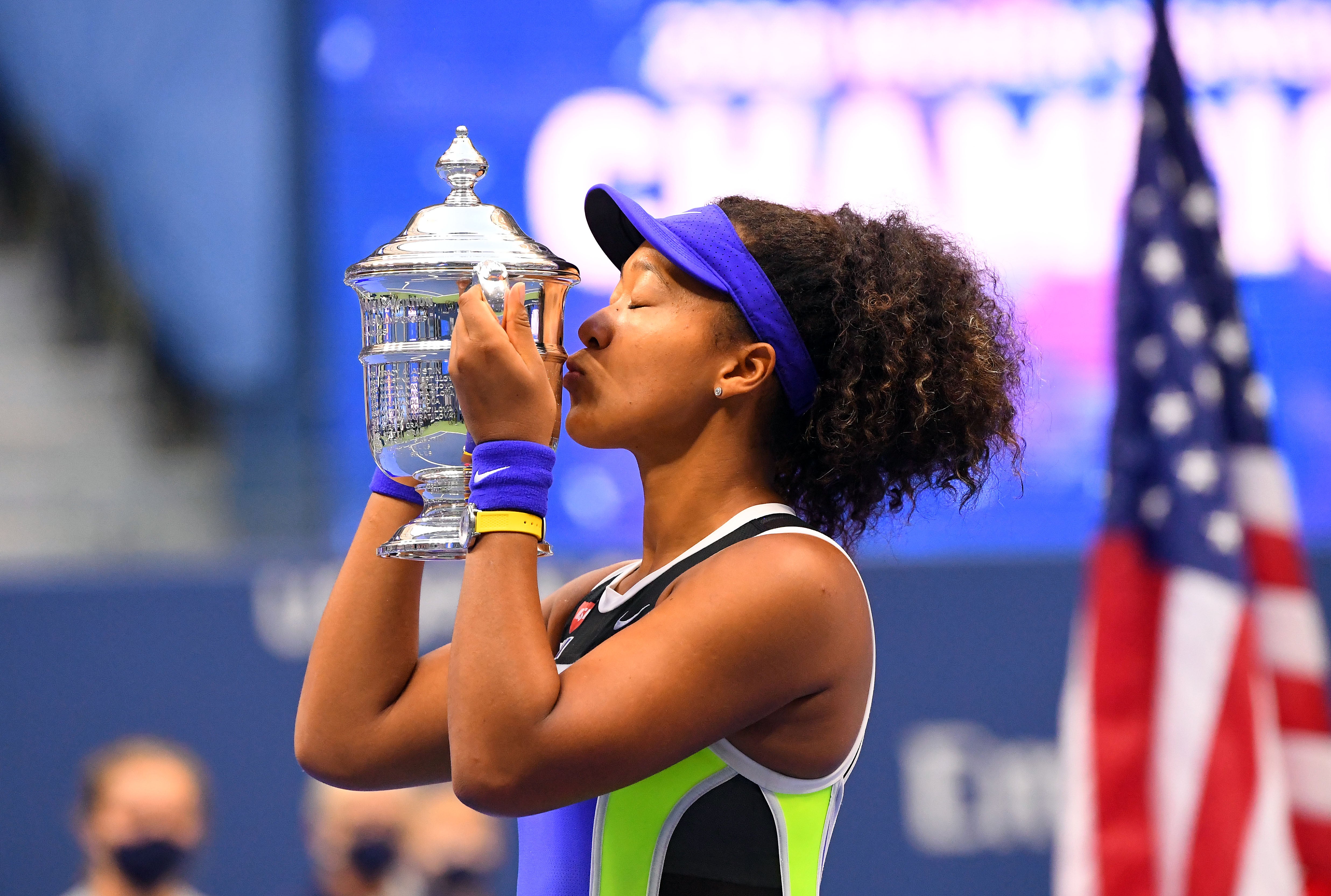Naomi Osaka celebrates with the US Open trophy