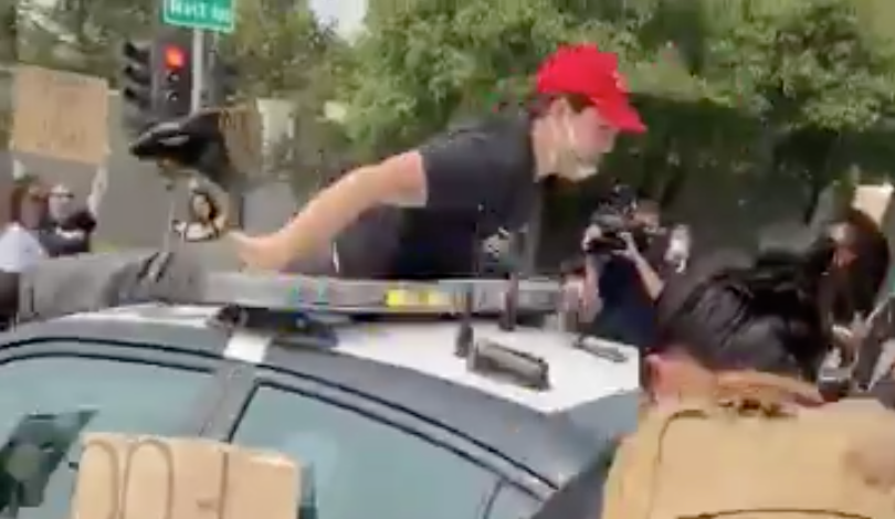 An anti-Trump protester was injured in Sacramento after falling from the roof of a highway patrol vehicle onto which he had climbed