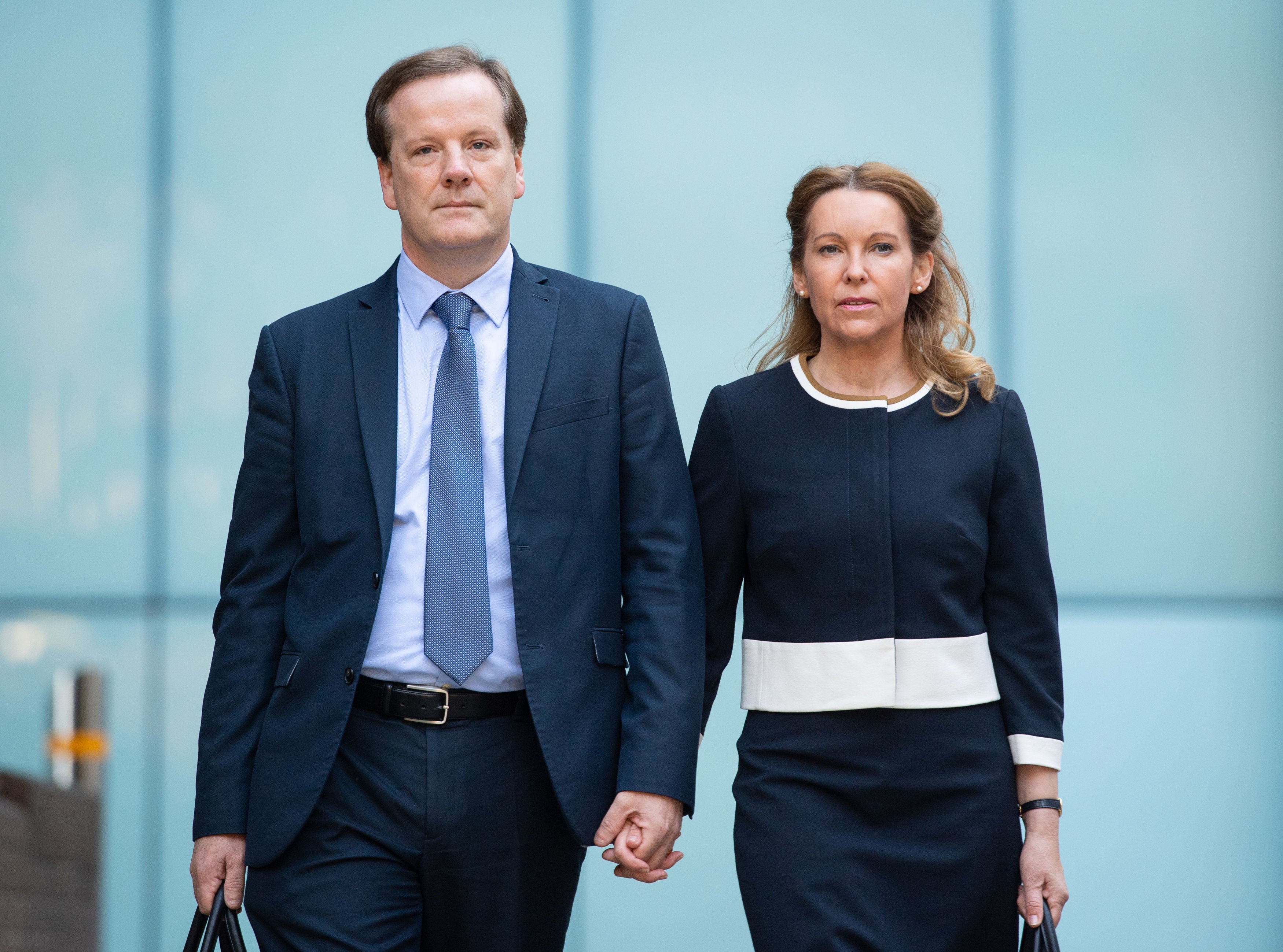 Charlie Elphicke with his now ex-wife outside court