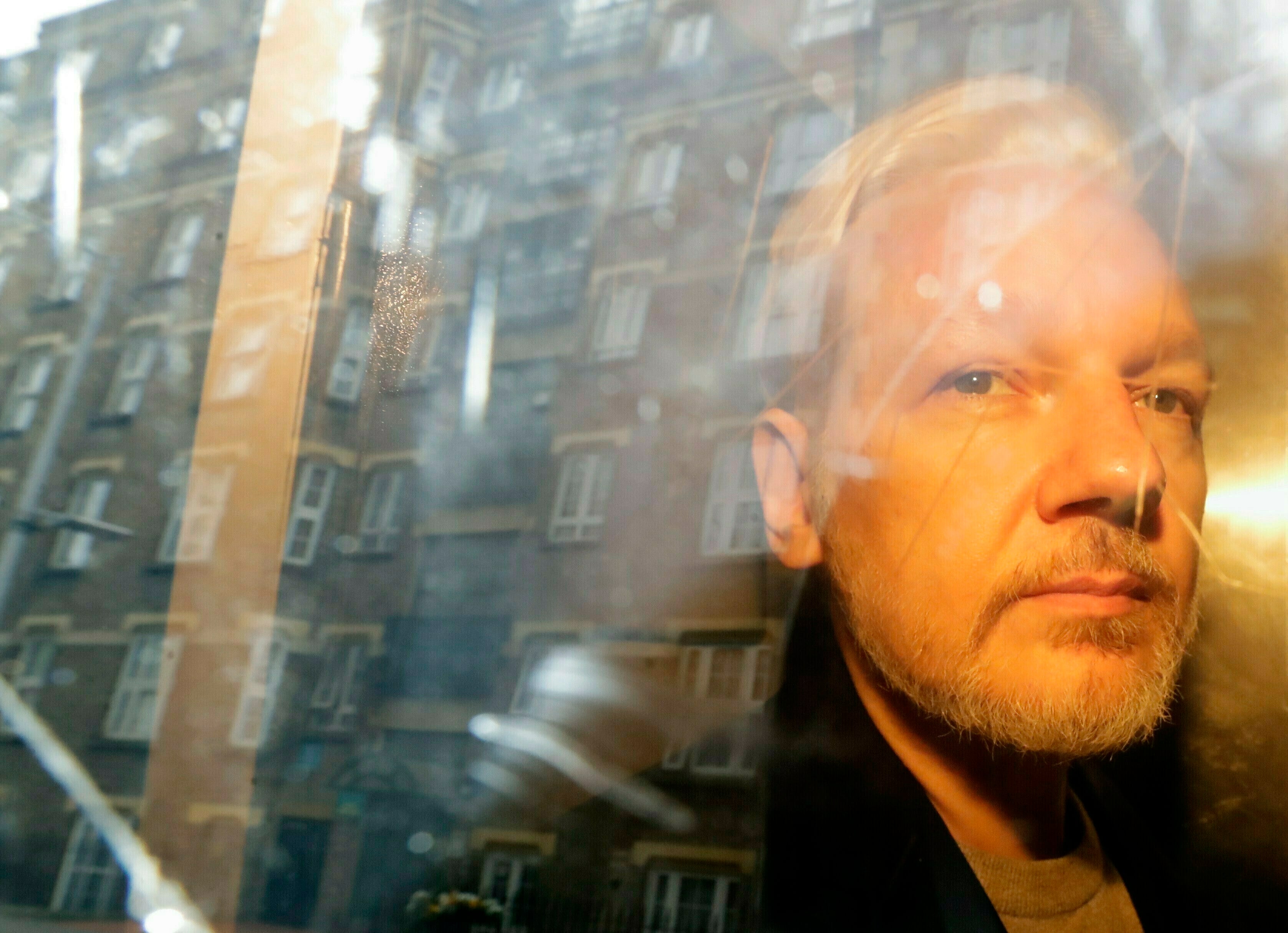 Assange is taken from court, where he appeared on charges of jumping British bail seven years ago, in London in May 2019