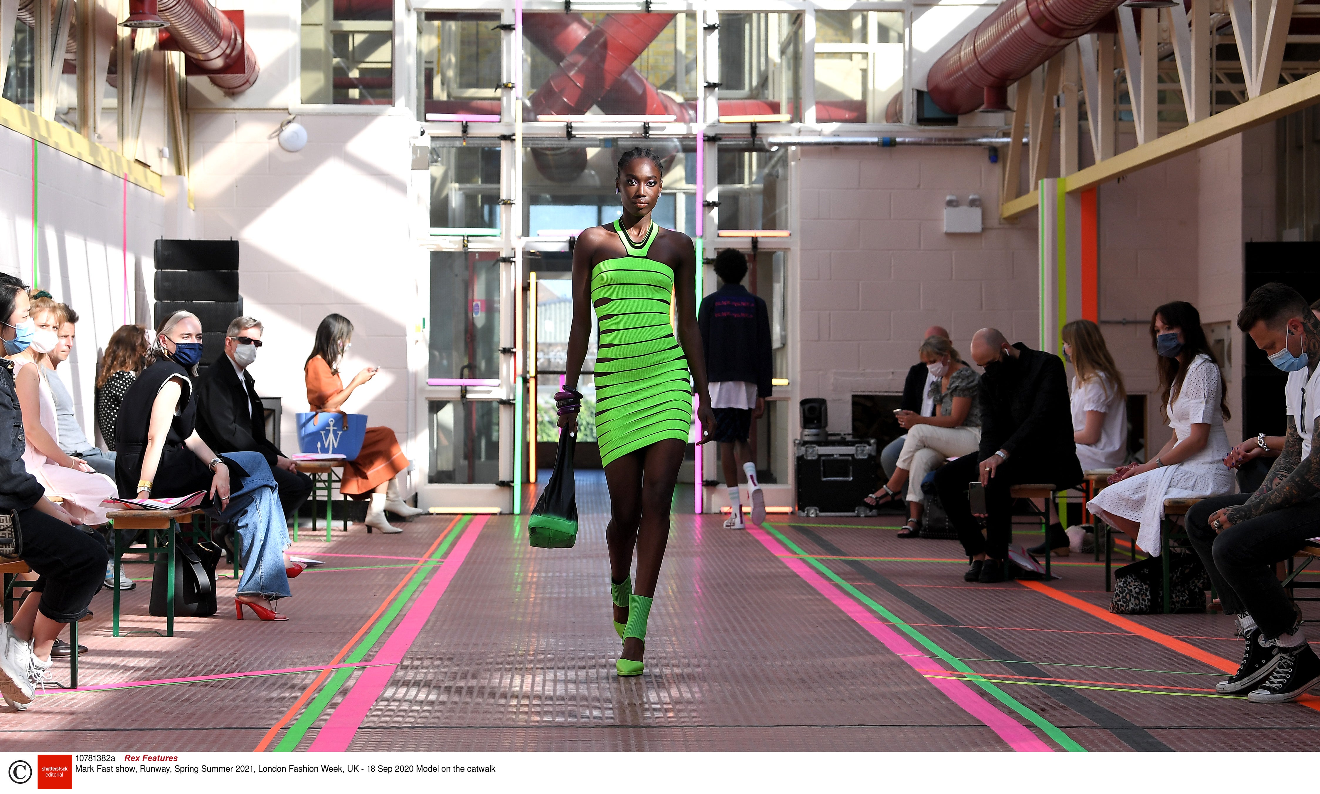 A model walks the runway in the Mark Fast SS21 show at Hackney Depot, on Friday 18 September