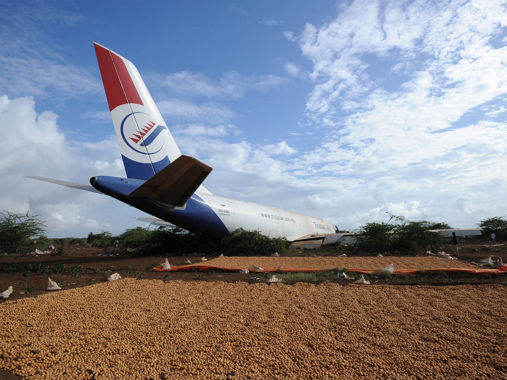 The wreckage of cargo plane carrying supplies for peacekeeping force troops after the crash outside Somalia's capital, on October 13, 2015