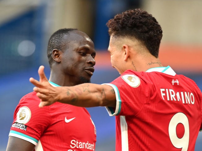 Sadio Mane celebrates with Roberto Firmino