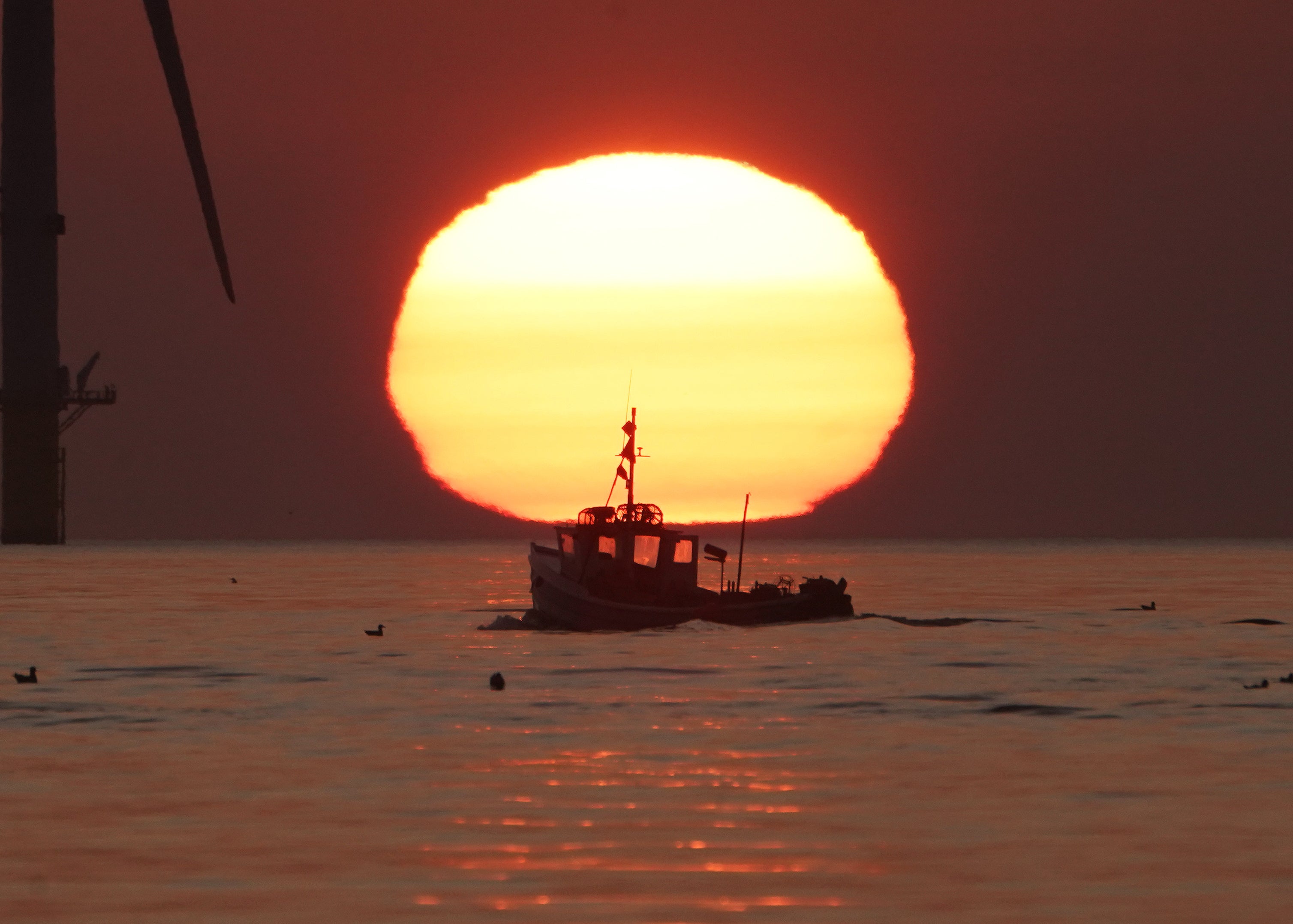 A fishing boat sails off the coast of Britain