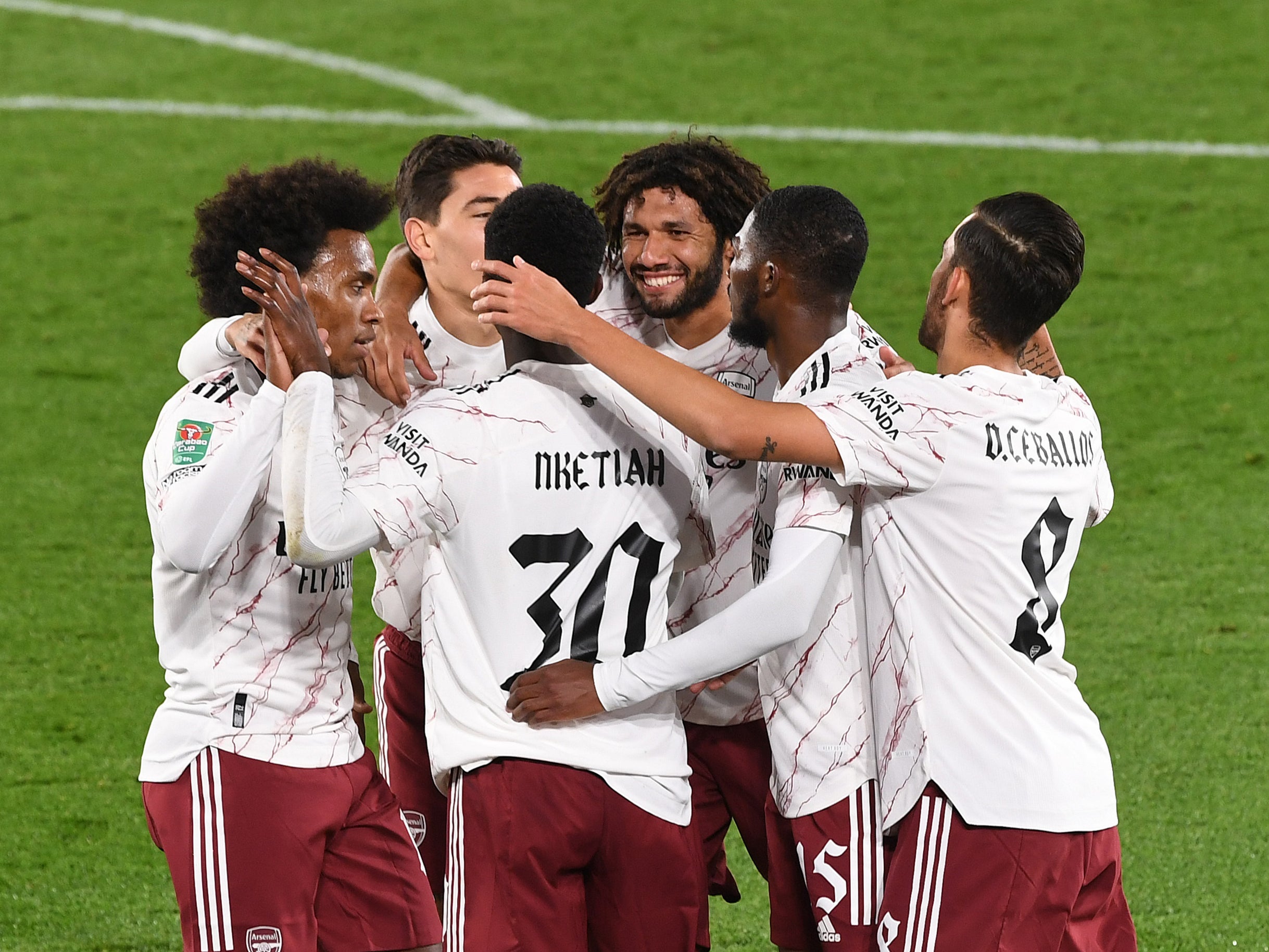 Arsenal players celebrate their win over Leicester