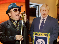 Van Morrison performs with cardboard Boris Johnson holding Covid sign