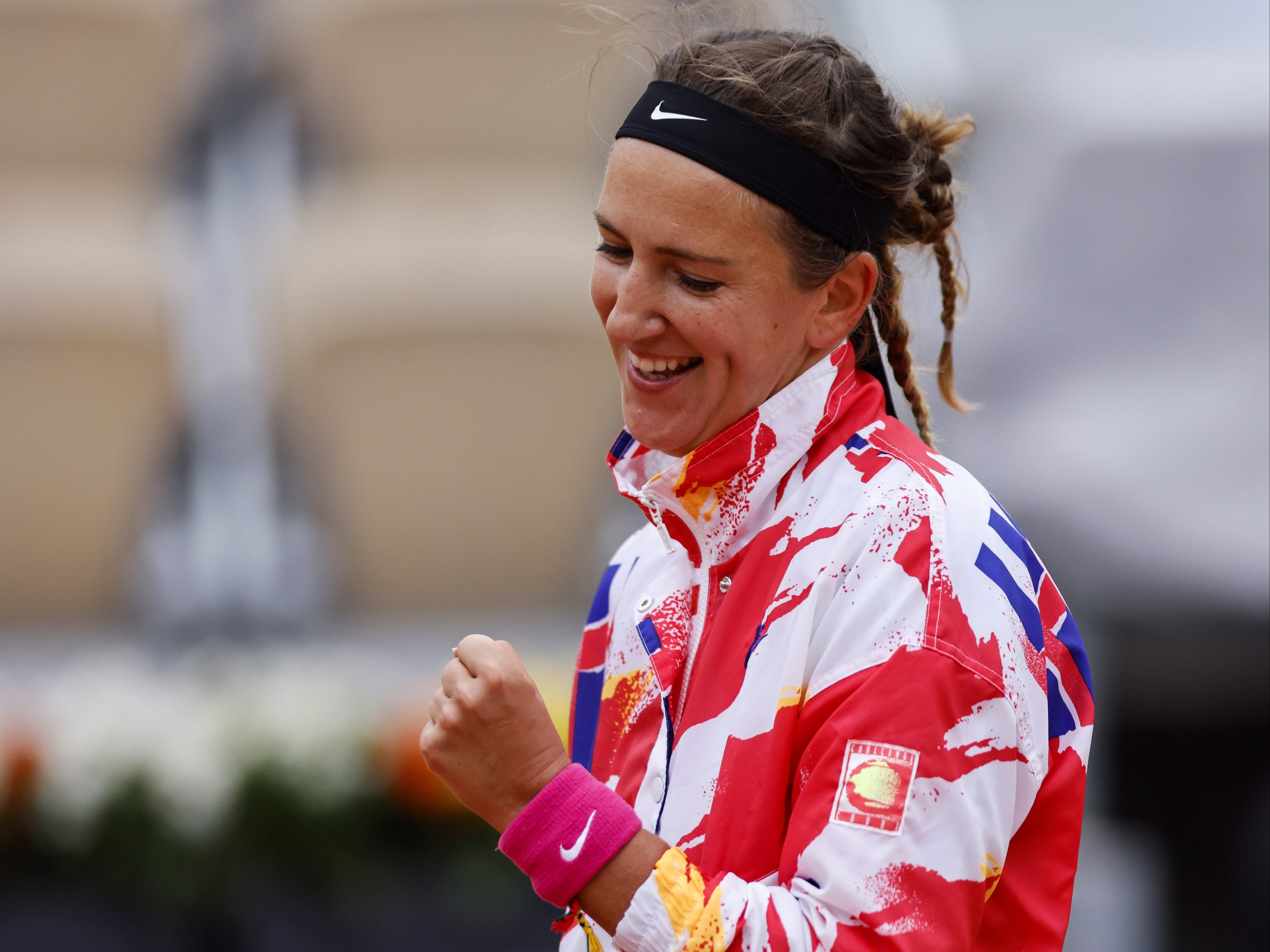 Victoria Azarenka celebrates advancing to the French Open second round