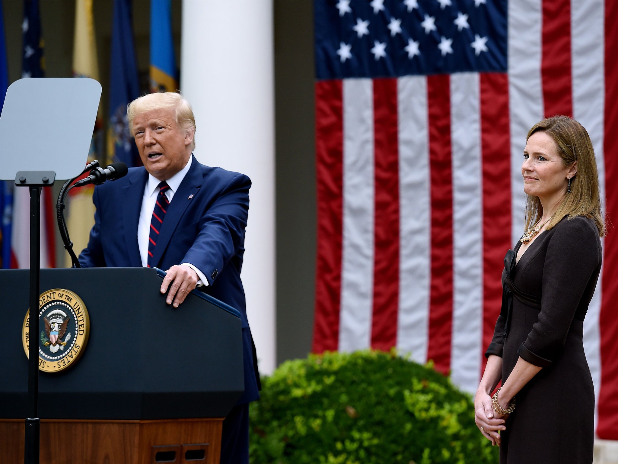 US President Donald Trump speaks next to Judge Amy Coney Barrett at the Rose Garden of the White House on September 26, 2020