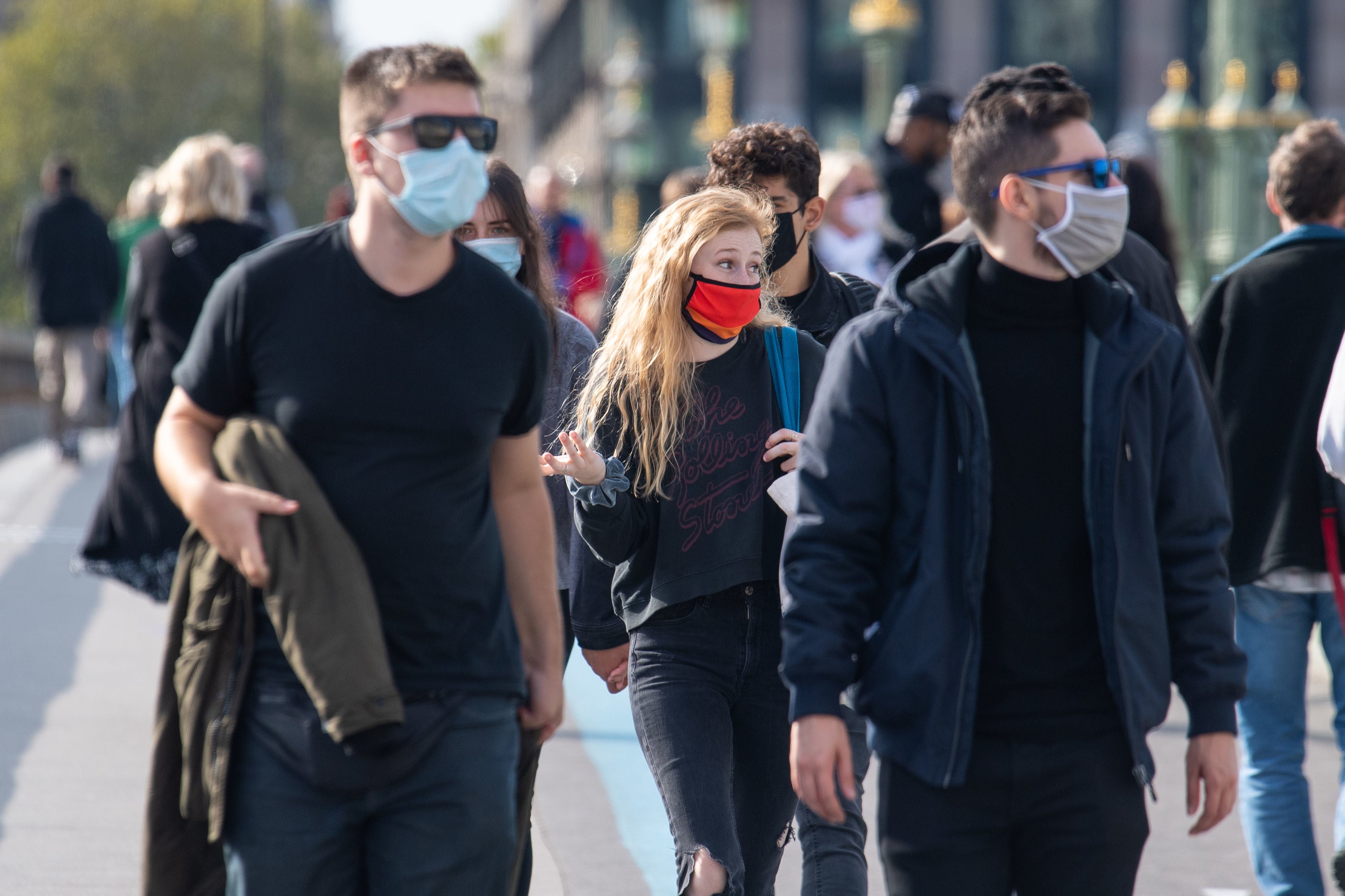 People wearing protective face masks in Westminster, London