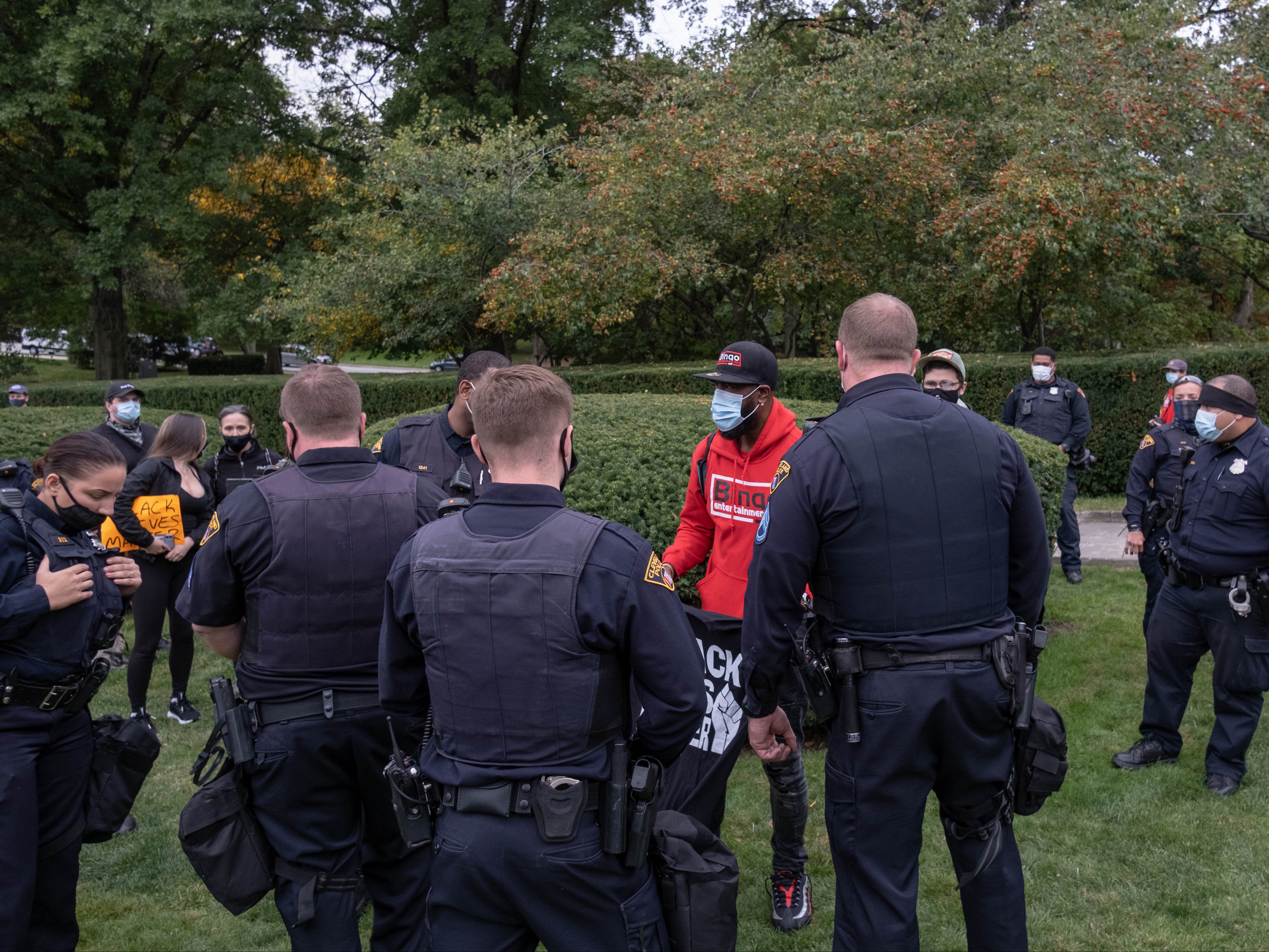 White Cleveland police officers stop a black man selling t-shirts in Wade Park, Ohio, on 29 September