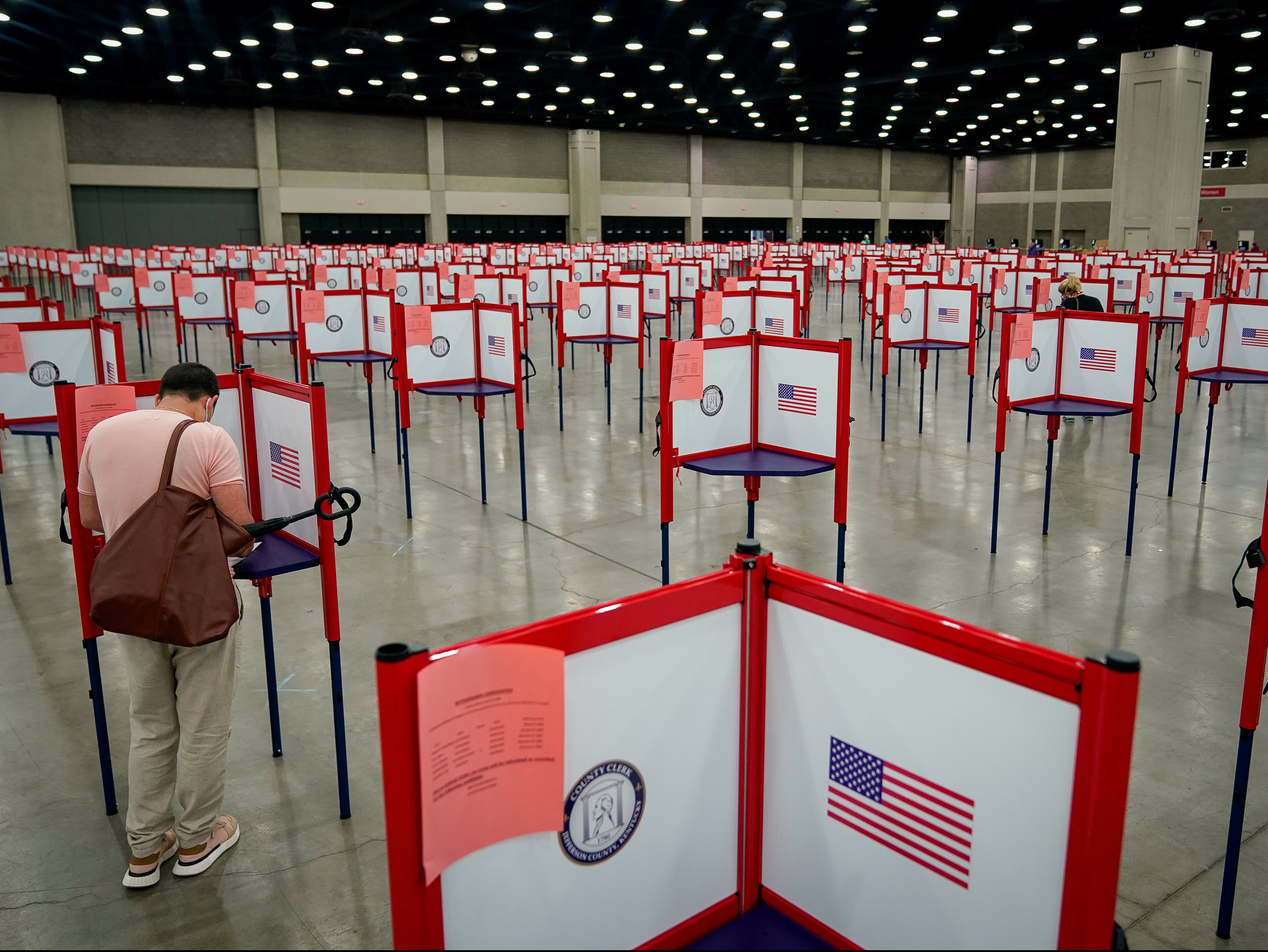 A voter completes his ballot on the day of the primary election in Louisville, Kentucky, US 23 June, 2020.