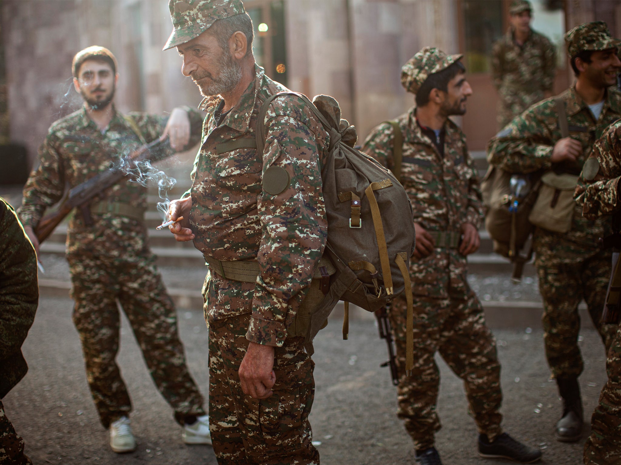 Ethnic Armenians volunteer recruits gather at a centre to receive uniforms and weapons before dispatched to frontline near Hadrut, self-proclaimed Republic of Nagorno-Karabakh, Azerbaijan, Tuesday, Sept. 29, 2020