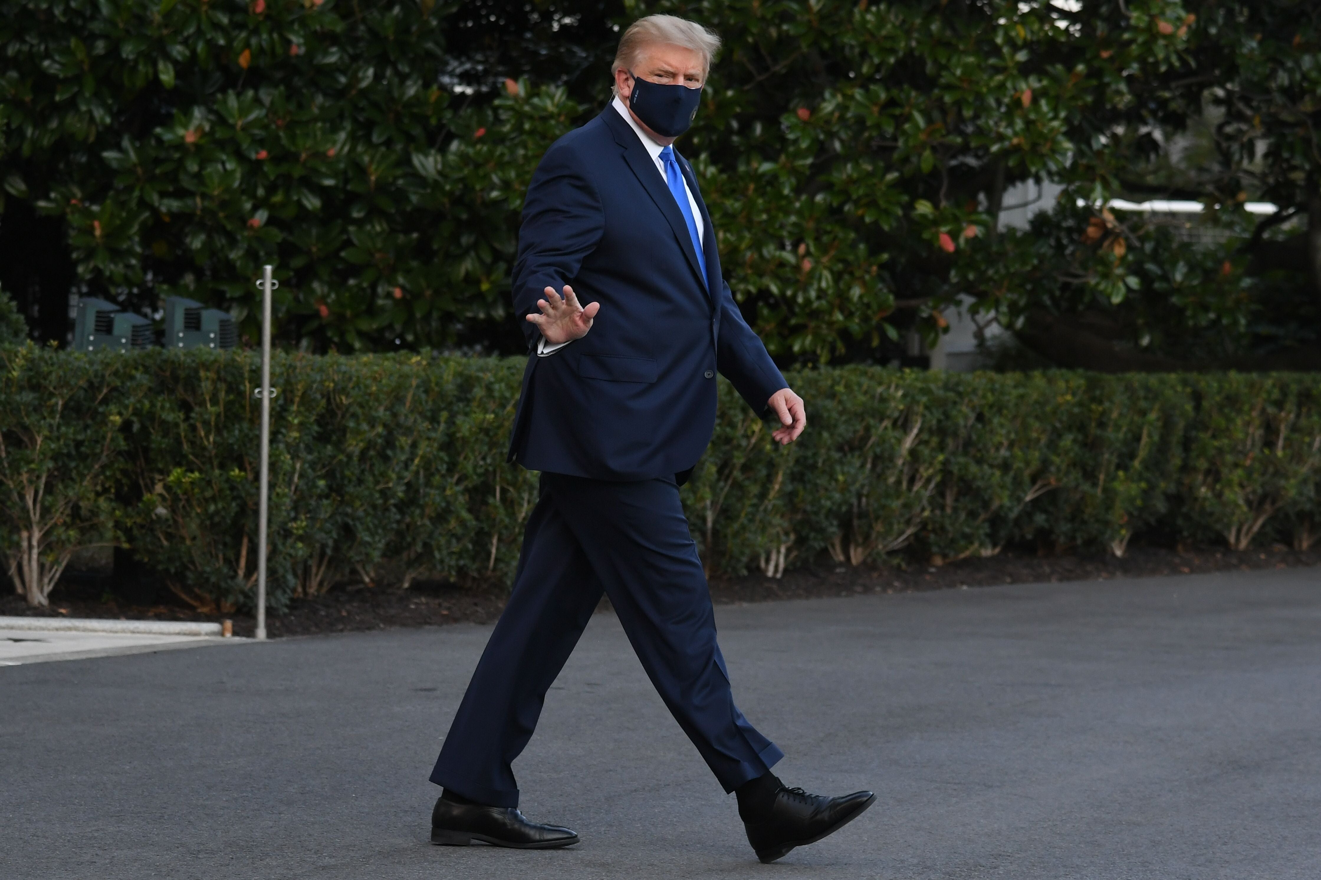 US President Donald Trump walks to Marine One prior to departure from the South Lawn of the White House in Washington, DC, October 2, 2020, as he heads to Walter Reed Military Medical Center, after testing positive for Covid-19. - President Donald Trump will spend the coming days in a military hospital just outside Washington to undergo treatment for the coronavirus, but will continue to work, the White House said Friday (Photo by SAUL LOEB / AFP) (Photo by SAUL LOEB/AFP via Getty Images)