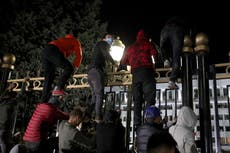 Kyrgyzstan election result cancelled after protesters storm parliament building and set fire to White House