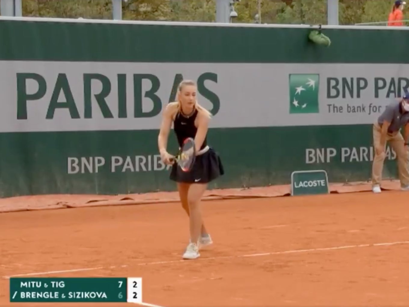 Yana Sizikova serves during the fifth game of the second set in her match with Madison Brengle against Andreea Mitu and Patricia Maria Tig