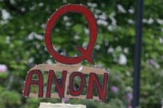 Facebook says it will ban groups for 'representing' QAnon