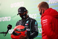 Hamilton given Schumacher’s helmet by son after record-equalling win