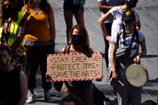 COVID-hit UK arts groups welcome government cash infusion