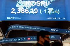 Asian shares mixed as China reports faster growth in trade