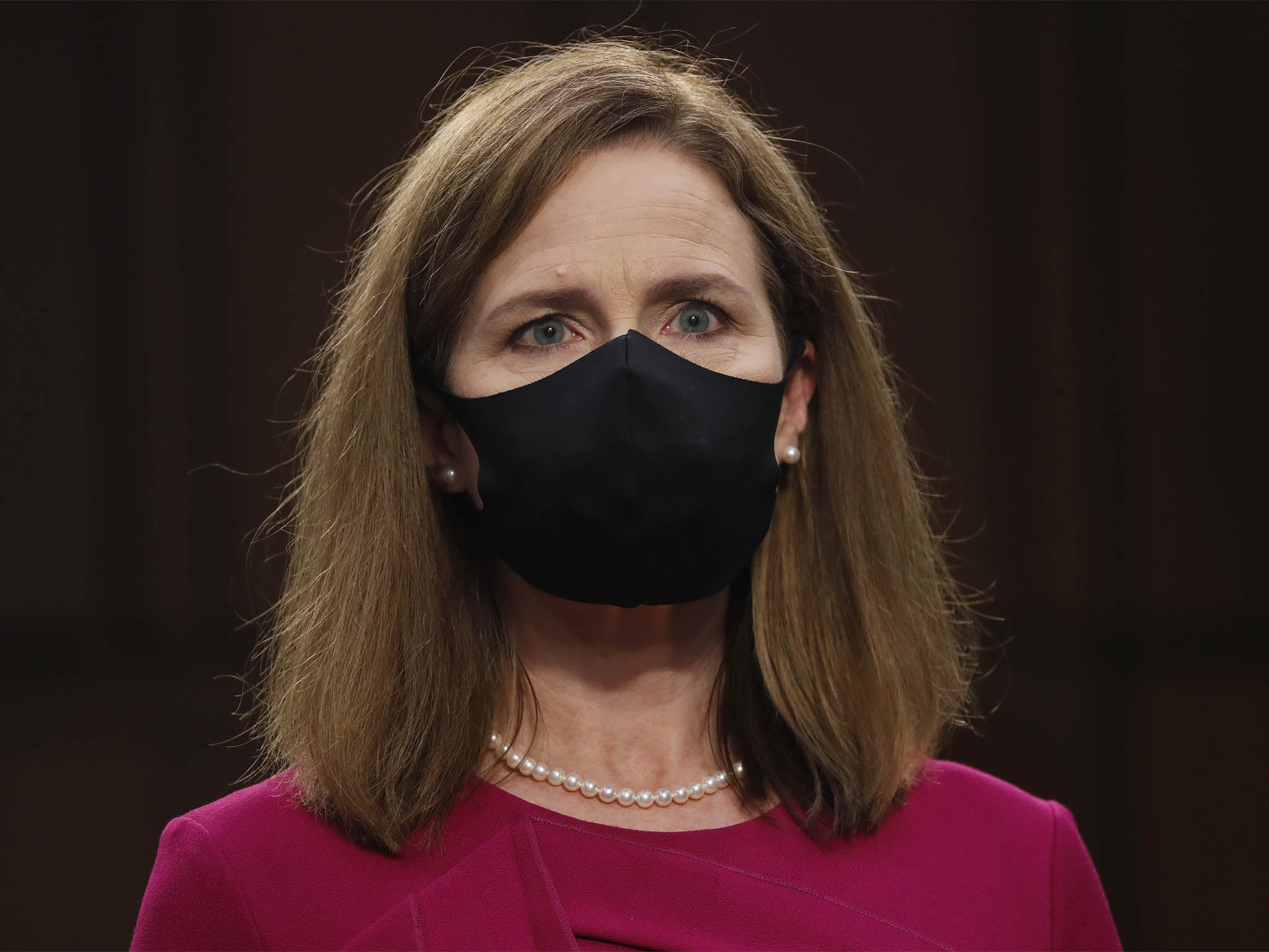 Supreme Court Justice nominee Judge Amy Coney Barrett stands after the Senate Judiciary Committee confirmation hearing for Supreme Court Justice in the Hart Senate Office Building