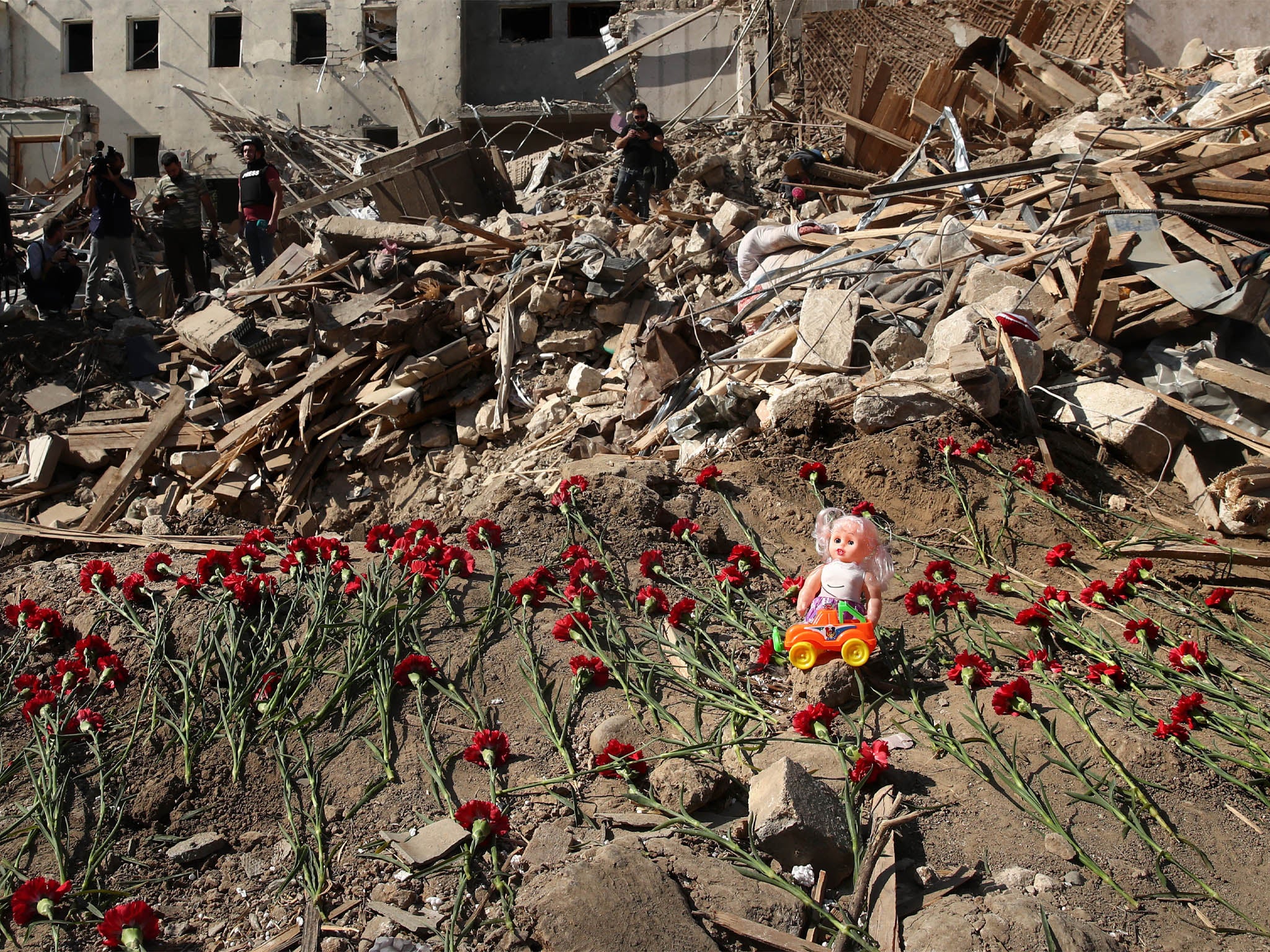 Commemorating people died in a rocket attack on a residential area of the city on 11 October