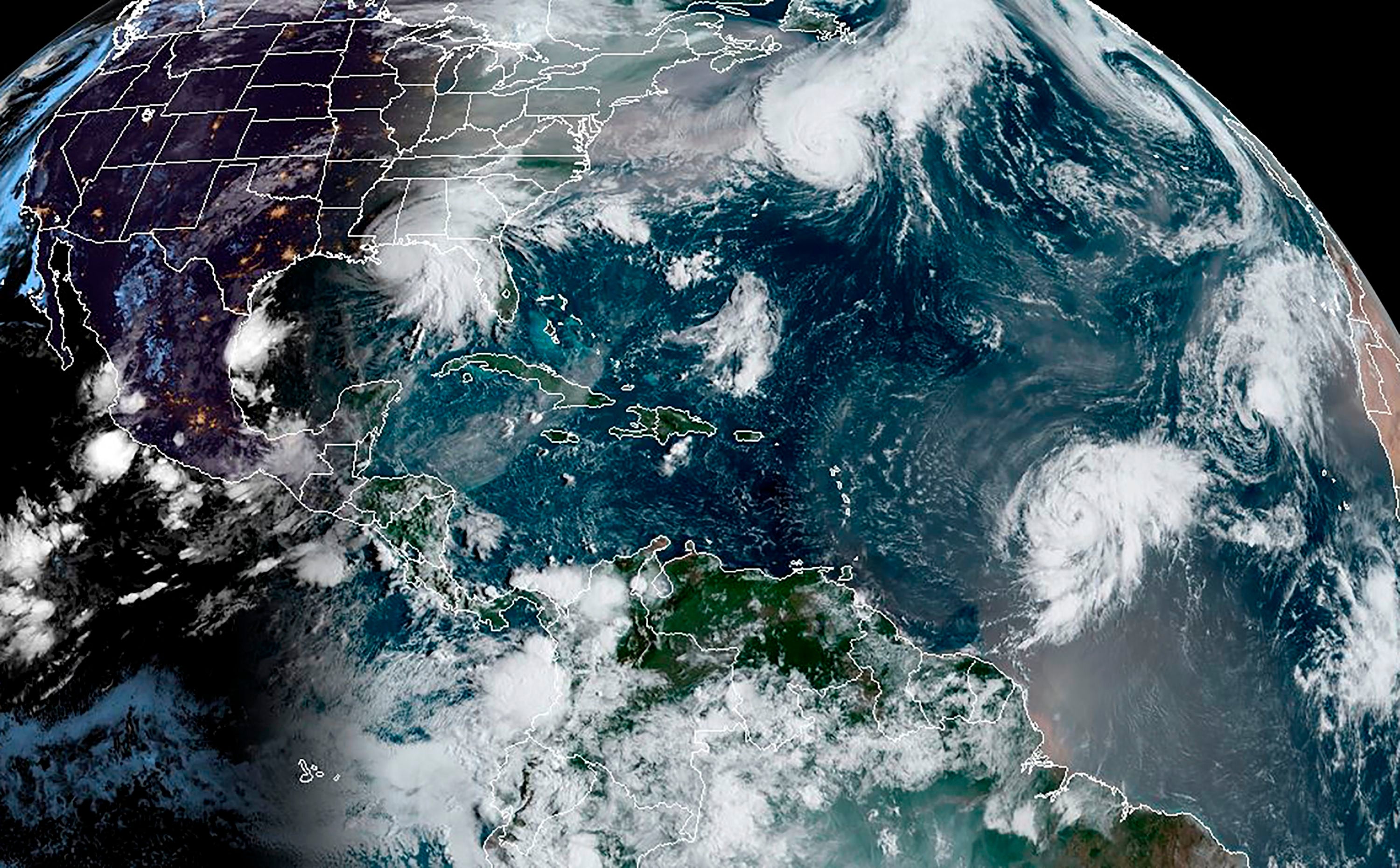 A satellite image shows various hurricanes in the Atlantic Ocean last month. The 2020 Atlantic hurricane season is the second most active on record - and its not over yet