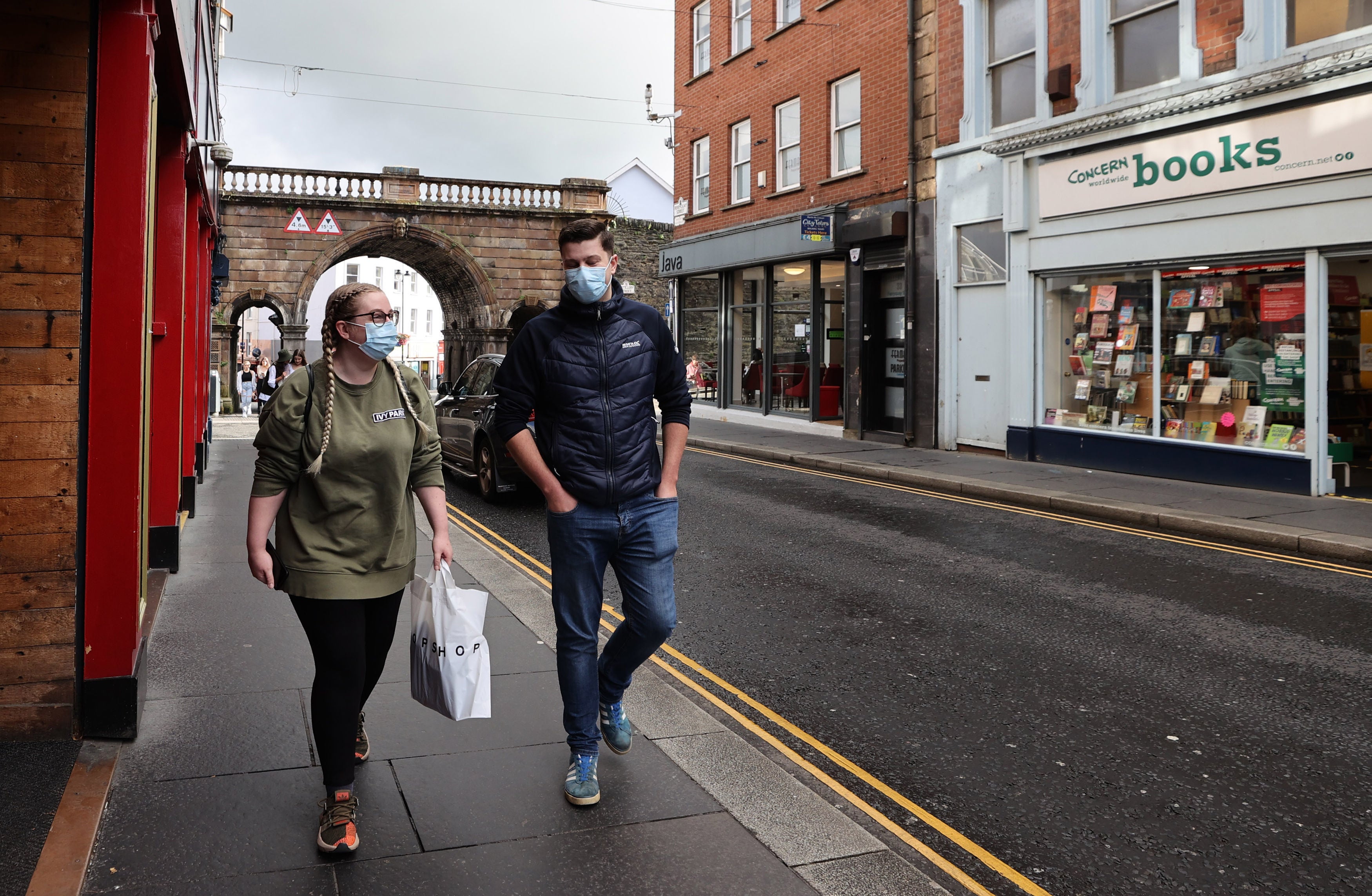 People walking along Ferryquay Street in Derry