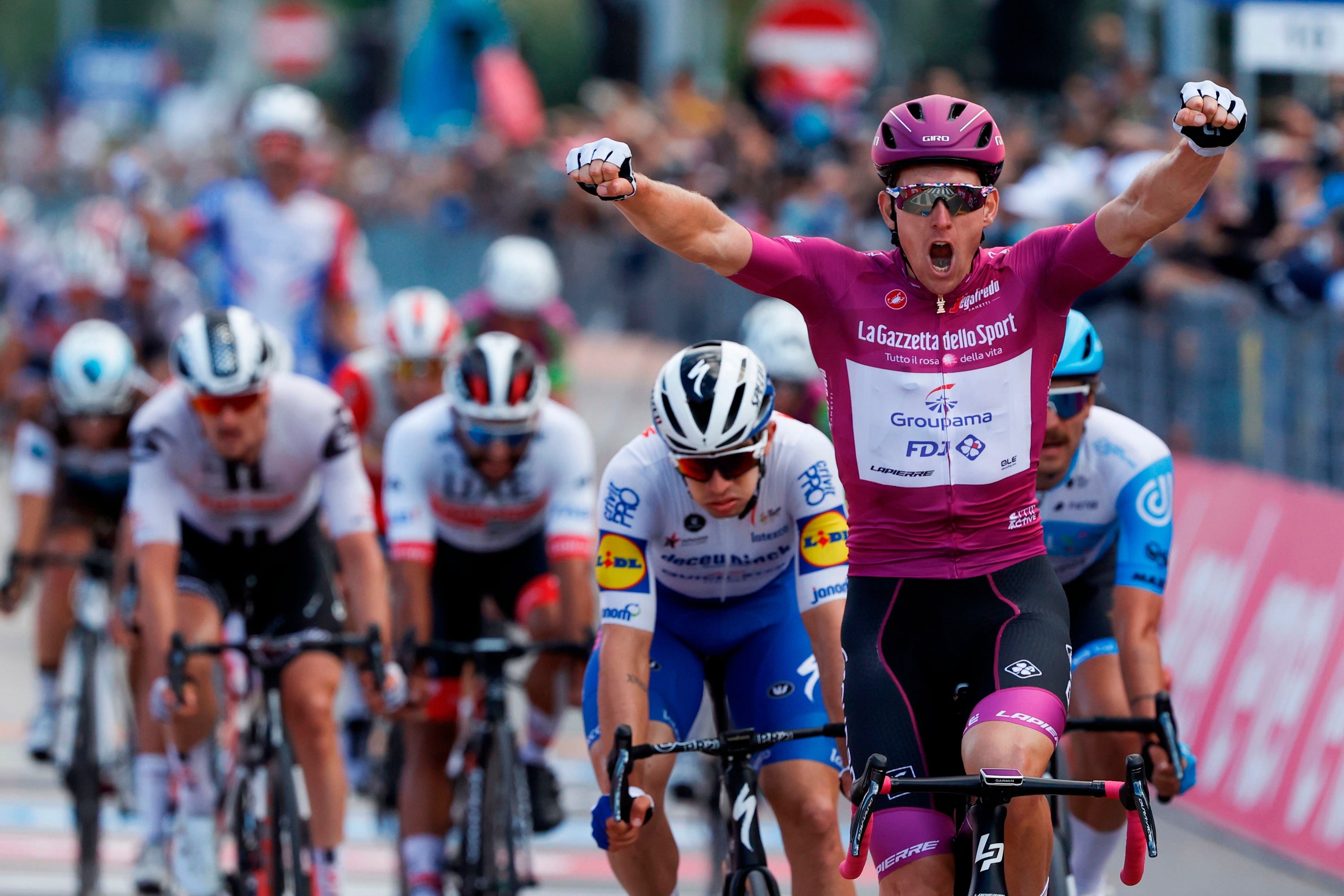 Arnaud Demare celebrates as he crosses the finish line