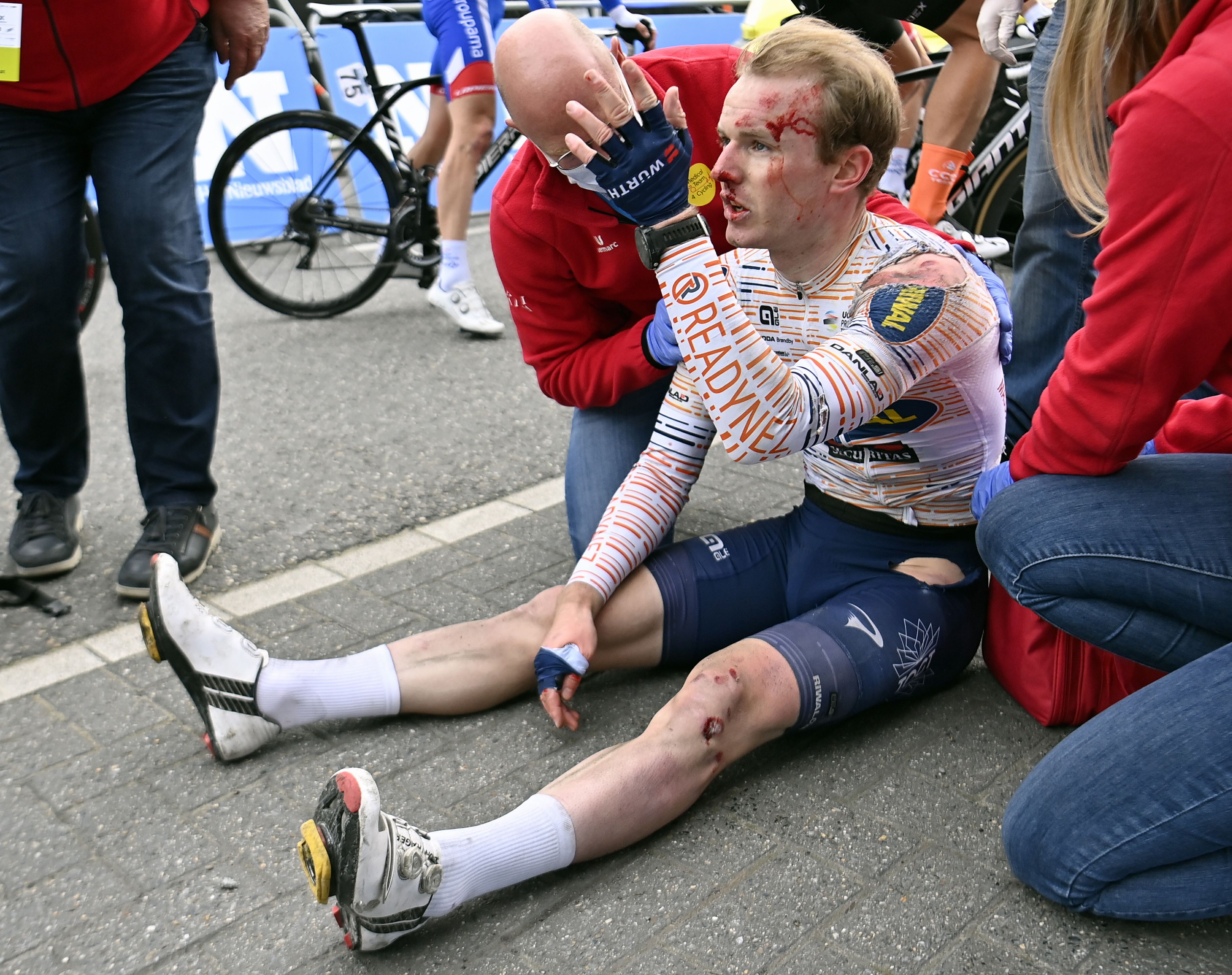 Norwegian rider August Jensen reacts after a crash