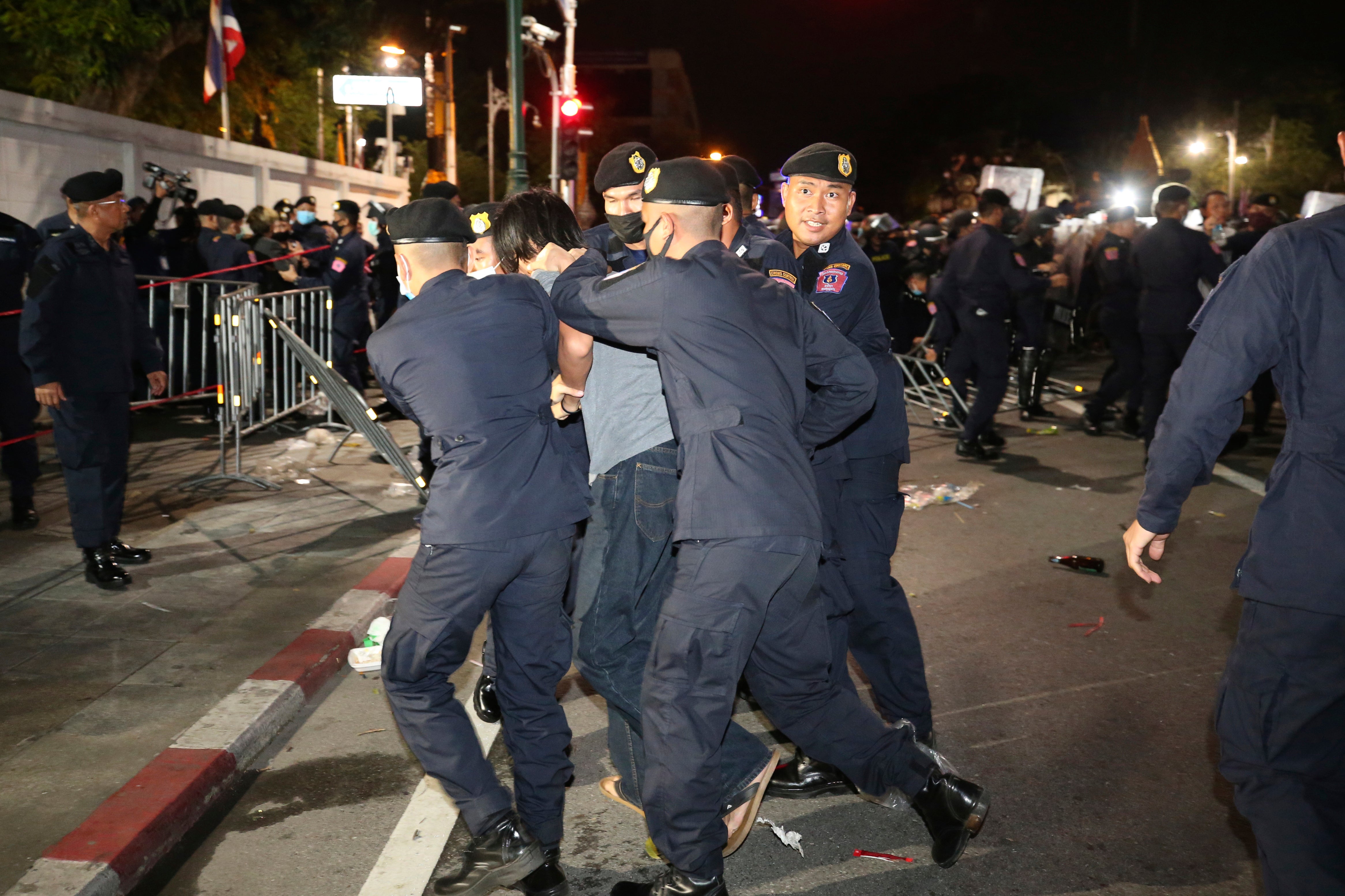 Thai police take away a pro-democracy protester during a demonstration in Bangkok, Thailand, on Thursday 15 October