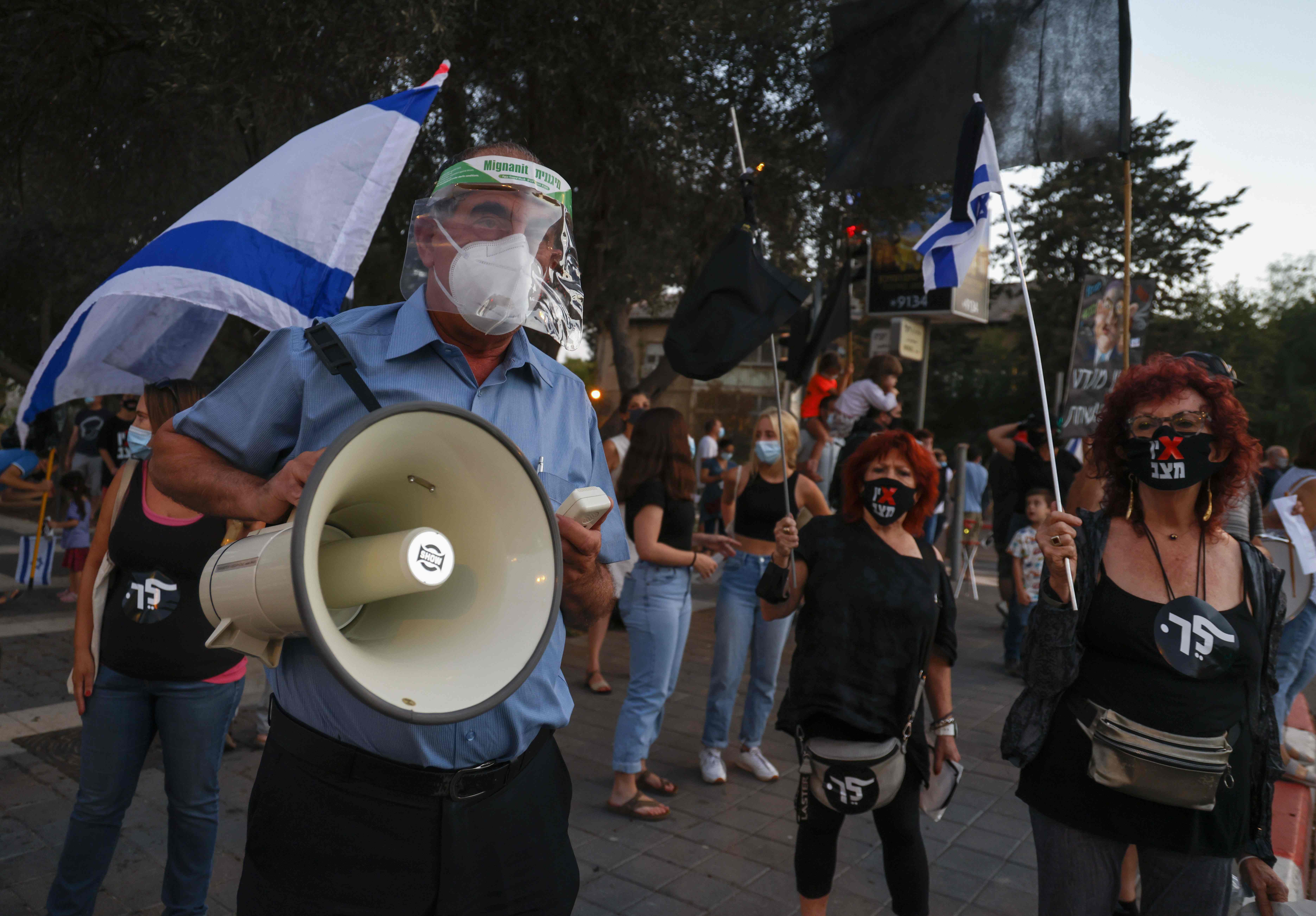 Israeli protesters gather for a demonstration against Prime Minister Benjamin Netanyahu’s government in Jerusalem