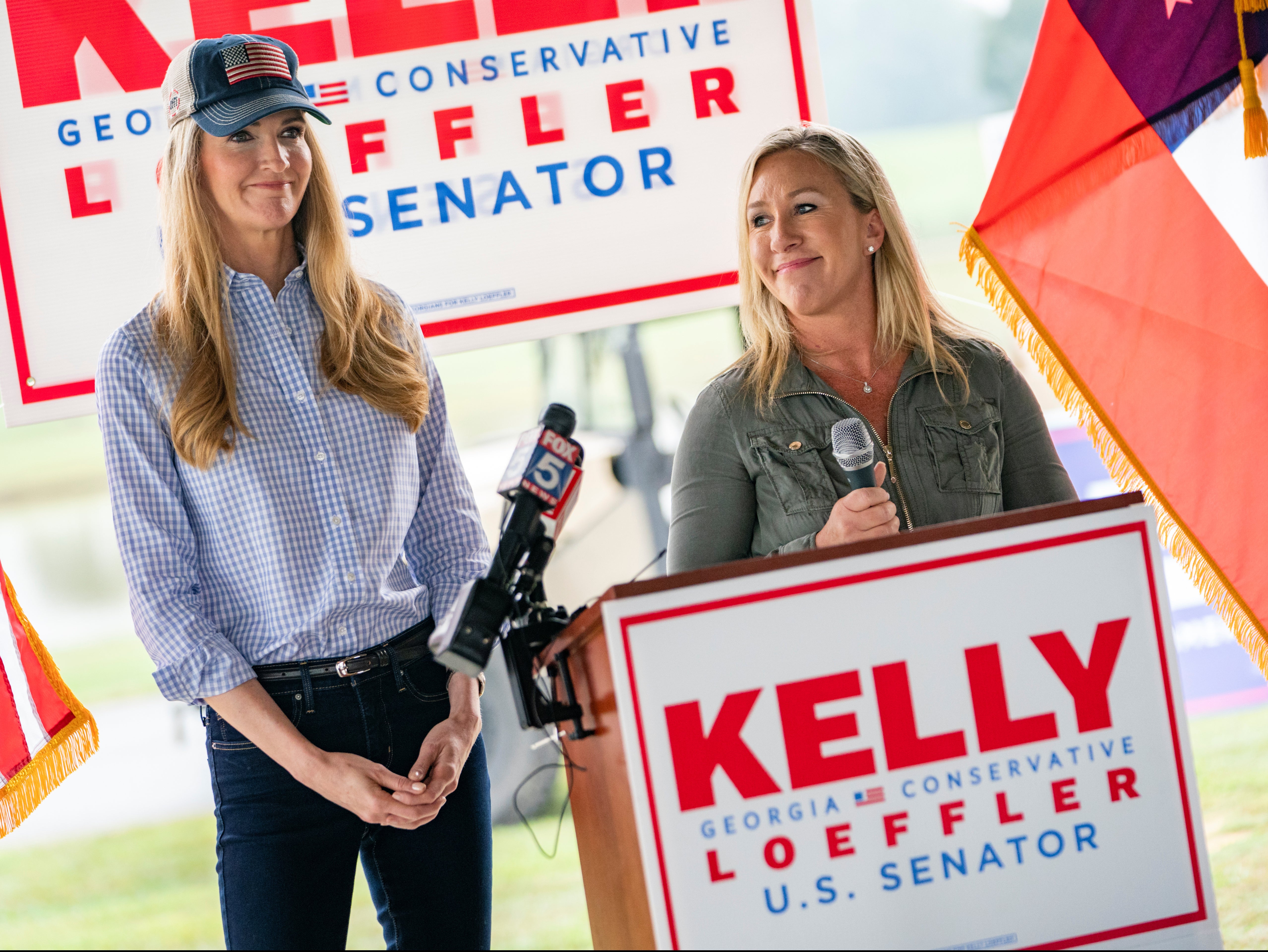 US Senator Kelly Loeffler and Republican U.S. House candidate Marjorie Taylor Greene speak at a news conference in Dallas, Georgia,