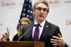 Some in North Dakota wish for tougher virus tack by governor