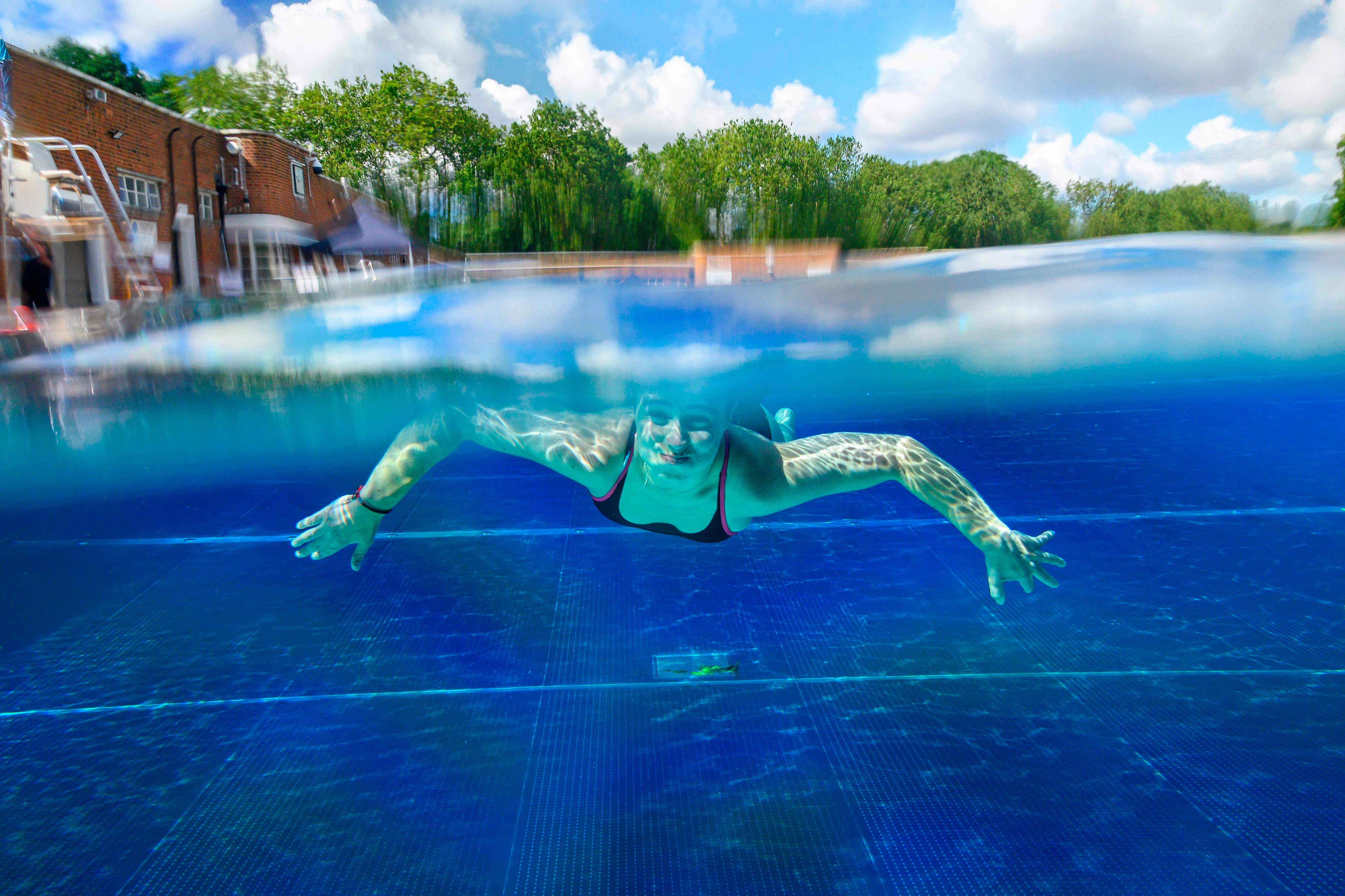 A person swims under water at Parliament Hill Lido in north London.