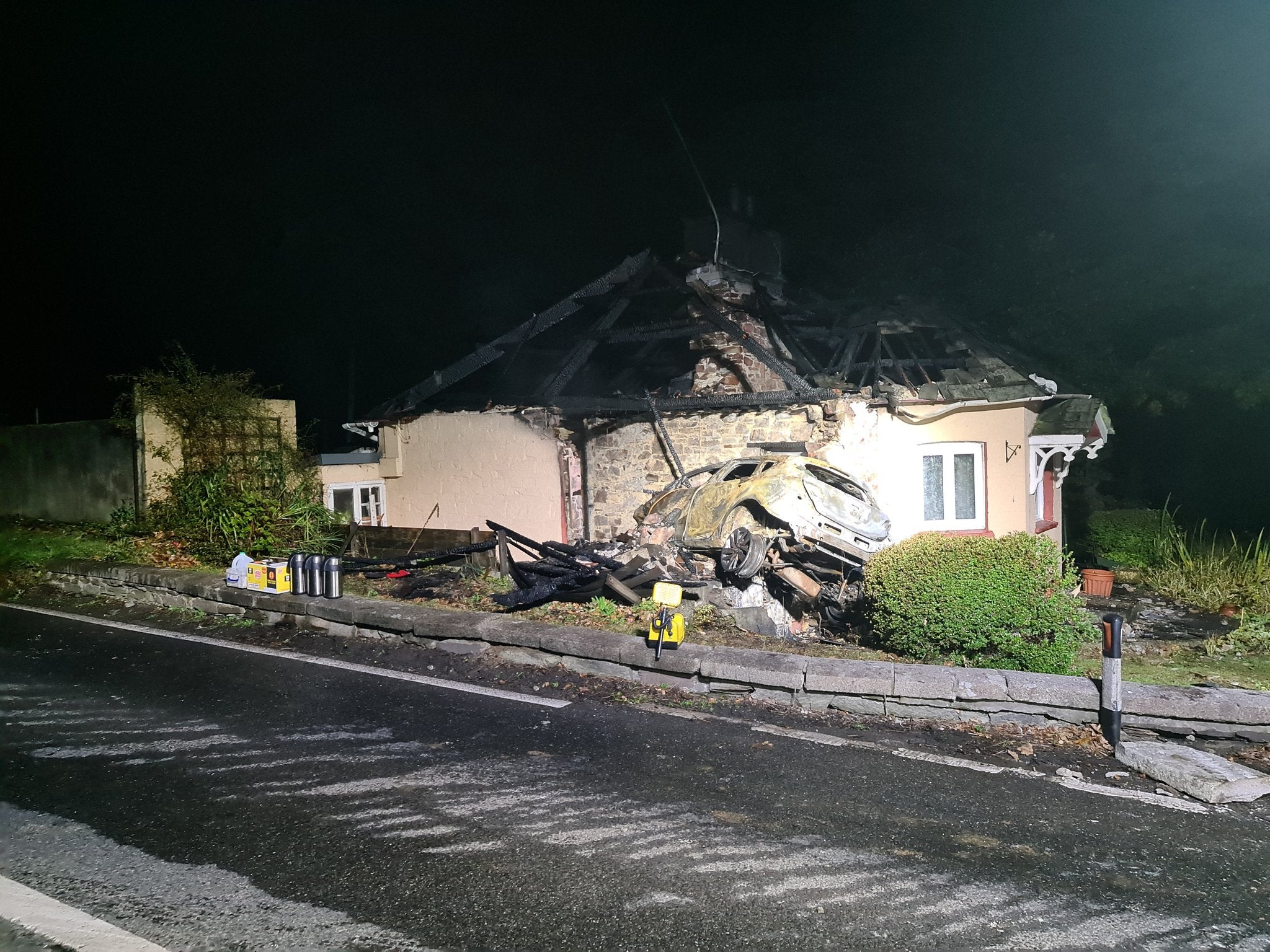 A photograph shows the extent of damaged caused by a car colliding with a property in Cornwall on 18 October, 2020.