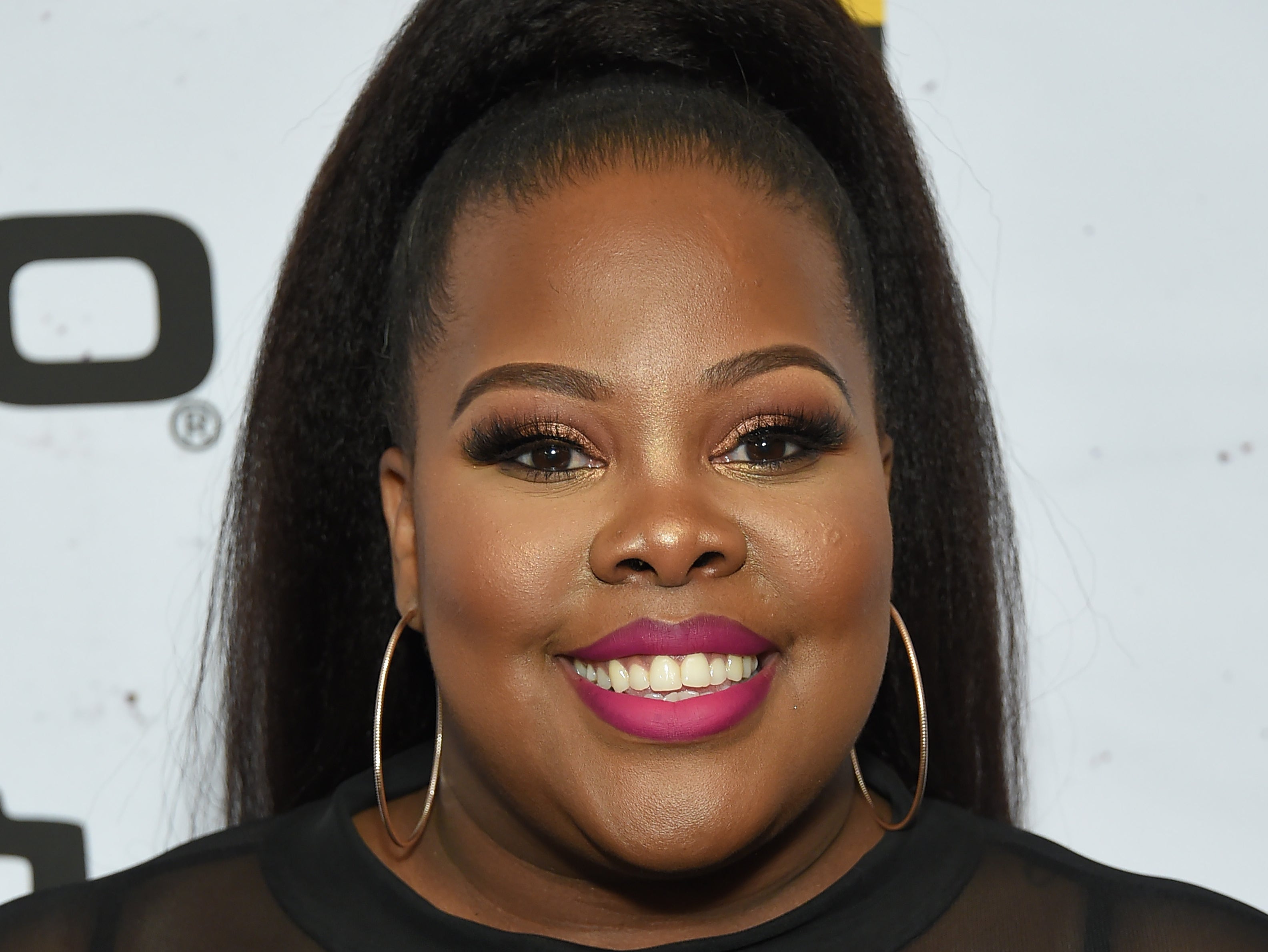 Amber Riley claims she experienced harassment from an ‘older white man’ wearing a Trump hat