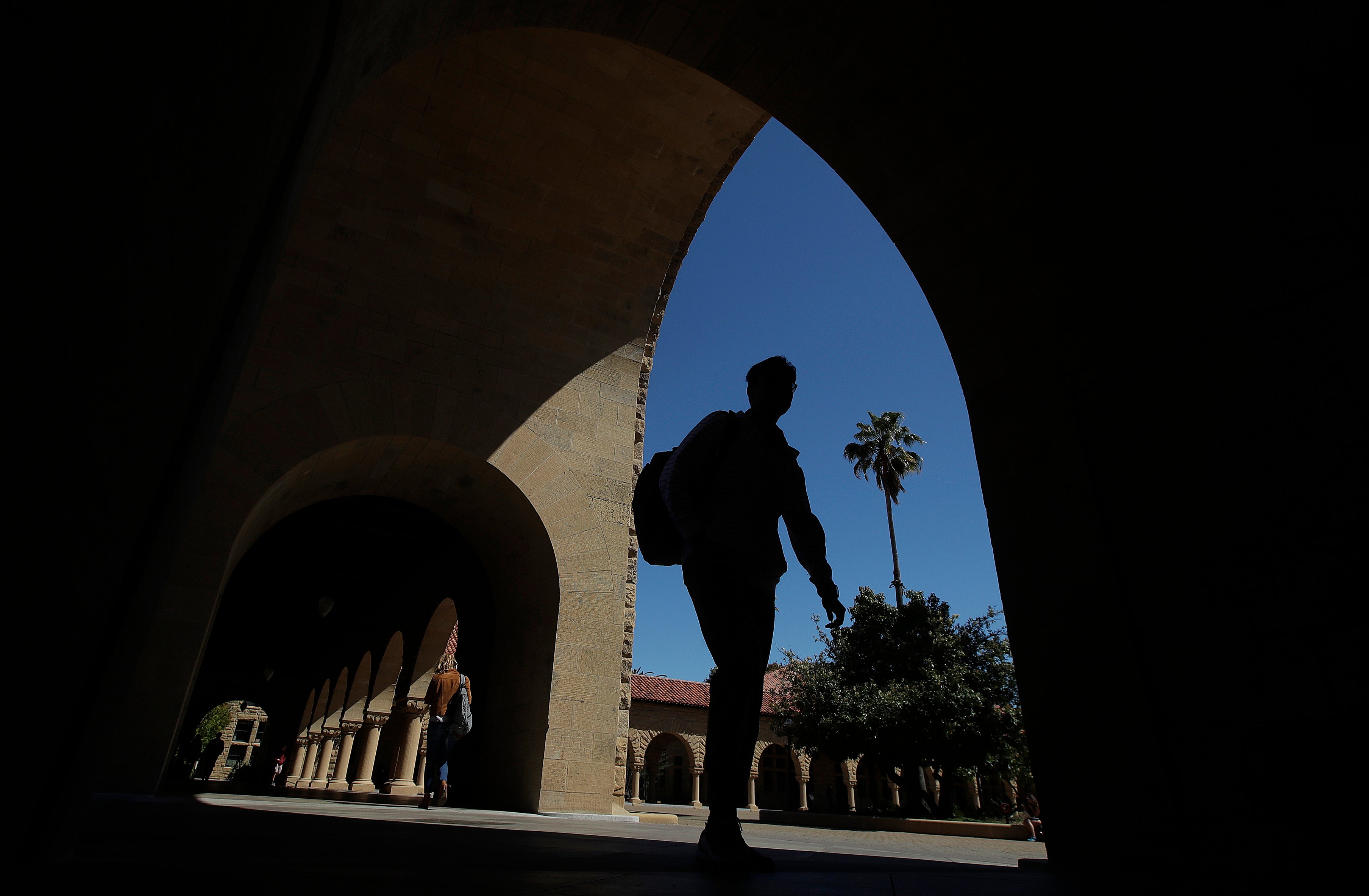 A college student walks through campus