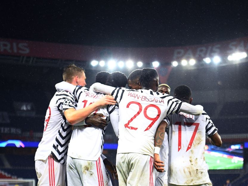 Manchester United celebrates their late winner at the Parc des Princes